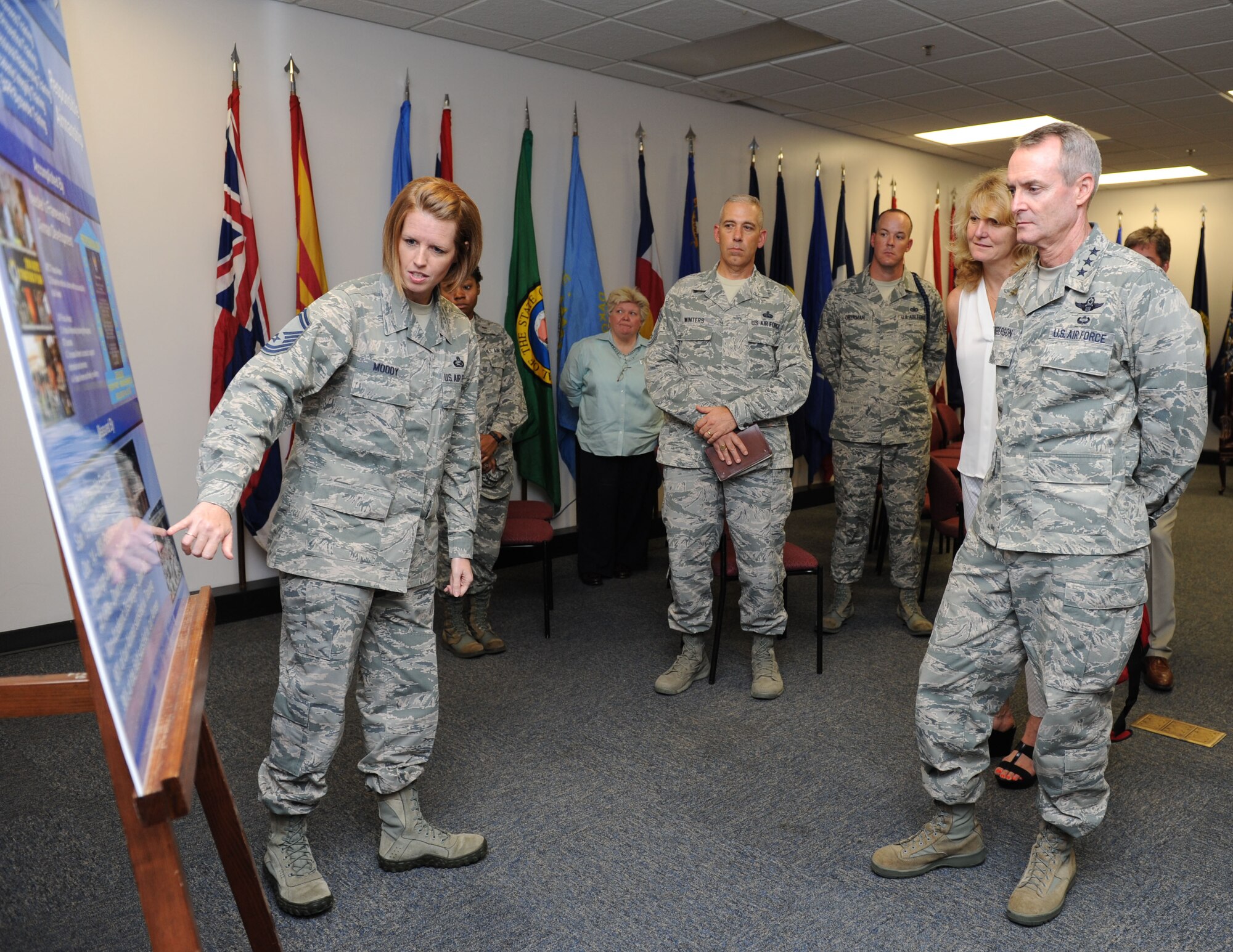 Senior Master Sgt. Heather Moody, 81st Force Support Squadron manpower and personnel flight superintendent, explains the impact the Campaign to Zero program has had on Airmen in the 81st Training Group to Lt. Gen. Darryl Roberson, commander of Air Education and Training Command, and his wife, Cheryl, at the Levitow Training Support Facility Aug. 12, 2015, during a site visit to Keesler Air Force Base, Mississippi. Roberson was also accompanied by Chief Master Sgt. Gerardo Tapia, AETC command chief. The two-day visit also included a base all call and tours of the 81st Medical Group, the Trainer Development Center and 2nd Air Force headquarters. (U.S. Air Force photo by Kemberly Groue)