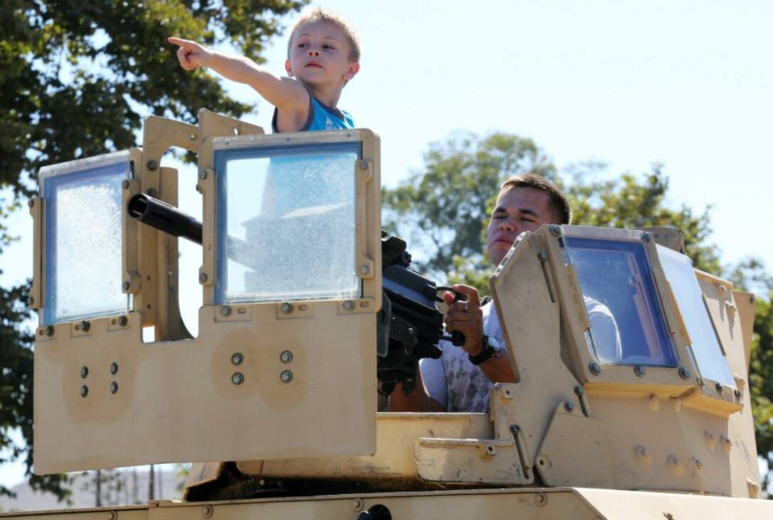 Marines introduce family members to the Marine Corps during the School of Infantry West's Family Day at the 52 Area Fitness Field, August 15. 

Family members were given the opportunity to ride Light Armored Vehicles and Assault Amphibious Vehicles, compete in the Combat Fitness Test, learn about marksmanship and weapons safety in the Indoor Simulated Marksmanship Trainer and travel to Range 210C to shoot the M27 Infantry Automatic Rifle.
