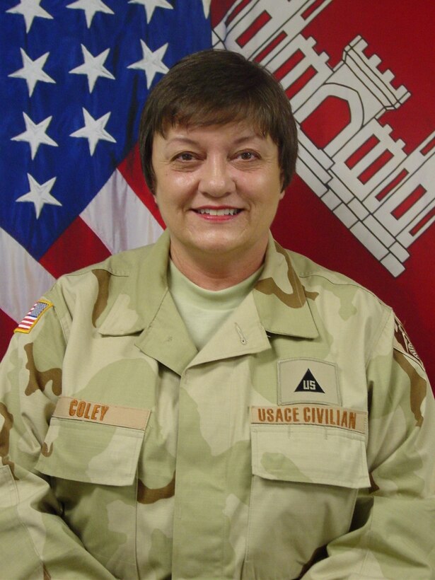 Martha Coley, pictured in her official deployment portrait, supported Operation Iraqi Freedom as a staff accountant from August 2007 to February 2008. As a Corps of Engineers employee based out of Millington, Tennessee, she often collected and sent donations to the Baghdad Division’s hospitals, orphanages and schools until she was selected for direct involvement. During her six month assignment, she worked directly with construction funding and contracts, but extended time to sort donations with the Morale, Welfare and Recreation committee and collect infant clothes for the birthing center facility built in Fallujah.