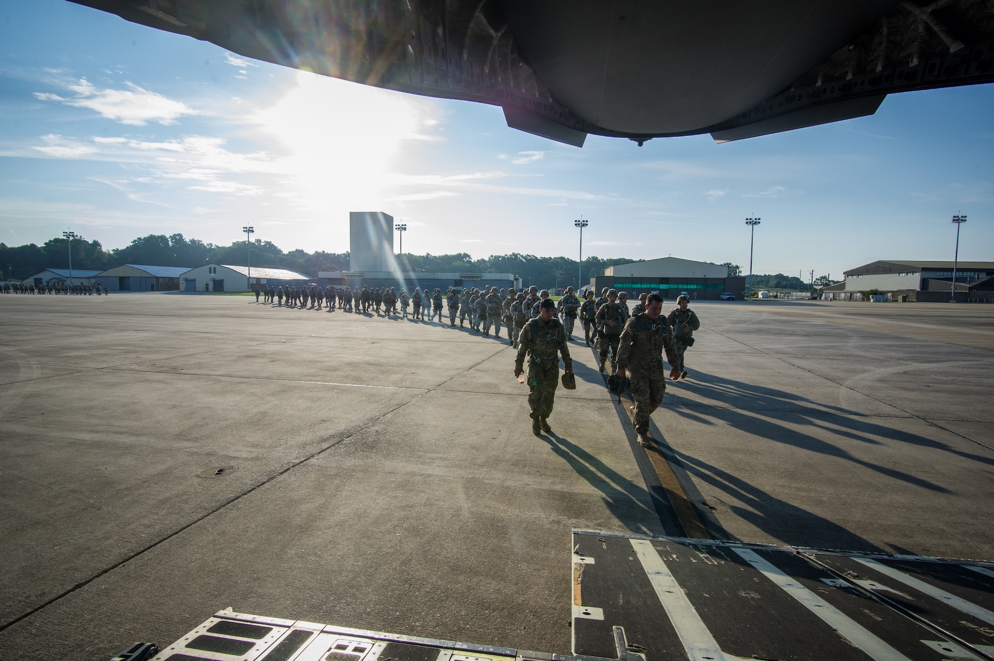 U.S. Army paratroopers walk toward the ramp of a C-17 Globemaster III Aug. 15, 2015 at Lawson Army Airfield, Fort Benning, Ga. Reserve aircrews from the 701st and 300th Airlift Squadron out of Joint Base Charleston, S.C. flew two C-17s during Fort Benning’s celebration of the 75th anniversary of the U.S. Army Airborne School. Almost 300 paratroopers took the big leap in the day’s event. (U.S. Air Force photo by Staff Sgt. Bobby Pilch)