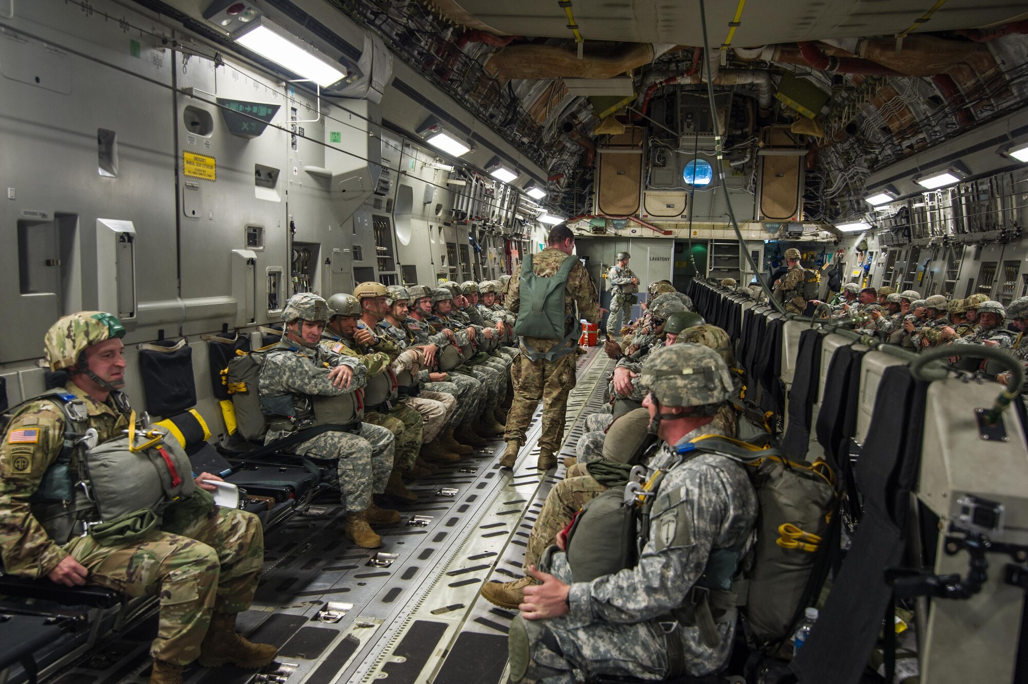 U.S. Army paratroopers being airlifted in a C-17 Globemaster III Aug. 15, 2015 over Lawson Army Airfield, Fort Benning, Ga. Reserve aircrews from the 701st and 300th Airlift Squadron out of Joint Base Charleston, S.C. flew two C-17s during Fort Benning’s celebration of the 75th anniversary of the U.S. Army Airborne School. Almost 300 paratroopers took the big leap in the day’s event. (U.S. Air Force photo by Staff Sgt. Bobby Pilch)