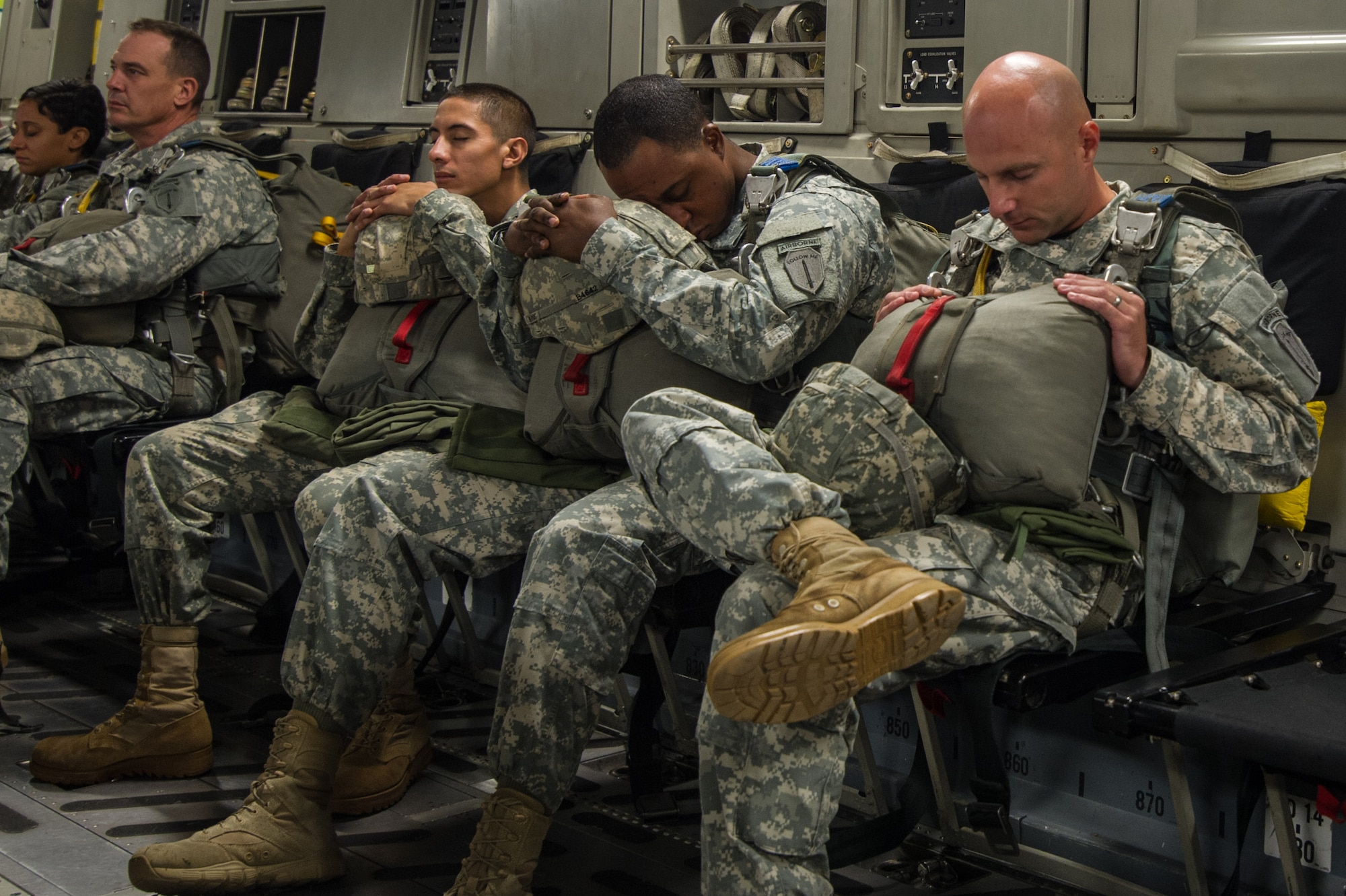 U.S. Army paratroopers being airlifted in a C-17 Globemaster III Aug. 15, 2015 over Lawson Army Airfield, Fort Benning, Ga. Reserve aircrews from the 701st and 300th Airlift Squadron out of Joint Base Charleston, S.C. flew two C-17s during Fort Benning’s celebration of the 75th anniversary of the U.S. Army Airborne School. Almost 300 paratroopers took the big leap in the day’s event. (U.S. Air Force photo by Staff Sgt. Bobby Pilch)