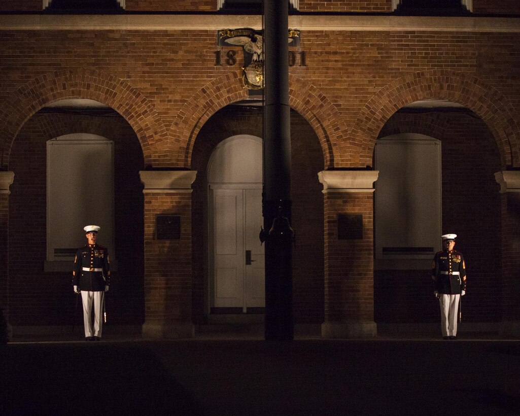Marines with Marine Barracks Washington, D.C., perform during an evening parade, Aug. 14, 2015. Lance Cpl. Joshua Leakey, recipient of the Victoria Cross, the highest military decoration for valor in the British and Commonwealth armed forces, was the guest of honor and Lt. Gen. Jon M. Davis, deputy commandant for Aviation, was the hosting official for that same parade. The Evening Parade began in 1934 and features the Silent Drill Platoon, the U.S. Marine Band, the U.S. Marine Corps Drum and Bugle Corps, and two marching companies. More than 3500 guests attend the parade every week. (U.S. Marine Corps photo by Lance Cpl. Christopher J. Nunn/Released)