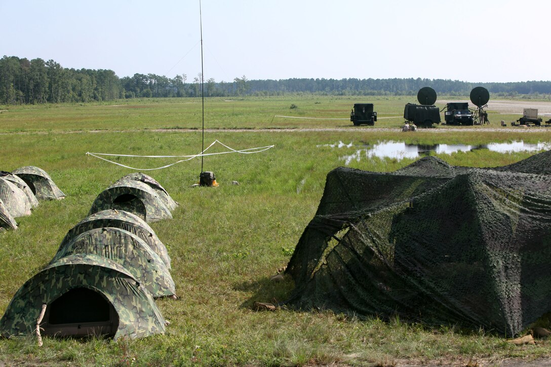 Marines from Alpha Company and Bravo Company with Marine Wing Communications Squadron 28 participate in field training exercises at Camp Davis and Outlying Landing Field Atlantic, North Carolina, Aug.12, 2015. The training served as a refresher course and is typically held anywhere from two to three times per year for tropospheric scatter radio multi-channel equipment-related military occupational specialties in the squadron.