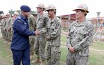 SANDAKAN, Malaysia (Aug. 17, 2015) - Royal Malaysian Air Force Maj. Gen. Dato' Kamalruzaman Mohd Othman shakes hands with Sailors assigned to Naval Mobile Construction Battalion (NMCB) 5 during Cooperation Afloat Readiness and Training (CARAT) Malaysia 2015. In its 21st year, CARAT is an annual, bilateral exercise series with the U.S. Navy, U.S. Marine Corps and the armed forces of nine partner nations including, Bangladesh, Brunei, Cambodia, Indonesia, Malaysia, the Philippines, Singapore, Thailand and Timor-Leste. 