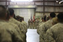 Marines with Special Purpose Marine Air Ground Task Force-Crisis Response-Central Command stand across from the color guard during the 7th Marine Regiment, 98th anniversary ceremony held in an undisclosed location in Southwest Asia, Aug. 15, 2015. The 7th Marine Regiment Headquarters and 3rd Battalion, 7th Marines are currently deployed with the SPMAGTF-CR-CC and took time to remember the regiment’s storied history and rededicate themselves to their current work with Operation Inherent Resolve.