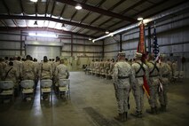 Marines with Special Purpose Marine Air Ground Task Force-Crisis Response-Central Command who have served under the 1st Marine Division remain standing for the playing of Waltzing Matilda during the 7th Marine Regiment’s 98th anniversary ceremony in an undisclosed location in Southwest Asia, Aug. 15, 2015. The 7th Marine Regiment Headquarters and 3rd Battalion, 7th Marines are currently deployed with the SPMAGTF-CR-CC and took time to remember the regiment’s storied history and rededicate themselves to their current work with Operation Inherent Resolve.