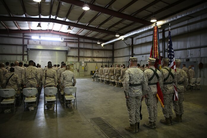 Marines with Special Purpose Marine Air Ground Task Force-Crisis Response-Central Command who have served under the 1st Marine Division remain standing for the playing of Waltzing Matilda during the 7th Marine Regiment’s 98th anniversary ceremony in an undisclosed location in Southwest Asia, Aug. 15, 2015. The 7th Marine Regiment Headquarters and 3rd Battalion, 7th Marines are currently deployed with the SPMAGTF-CR-CC and took time to remember the regiment’s storied history and rededicate themselves to their current work with Operation Inherent Resolve.