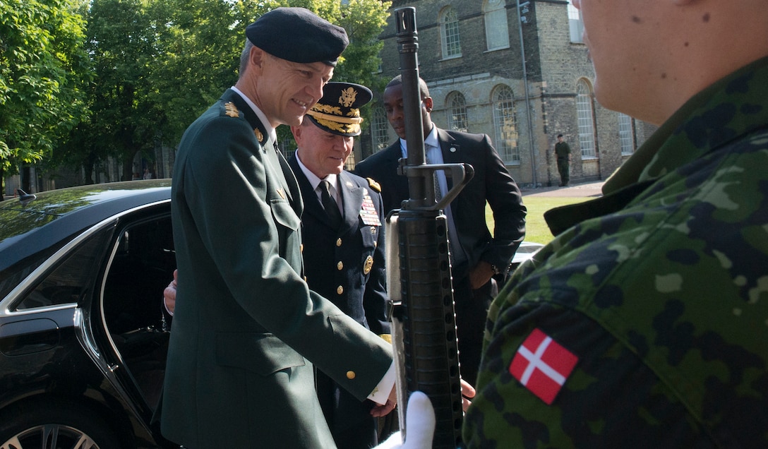 Danish Chief of Defense Army Gen. Peter Bartram greets U.S. Army Gen. Martin E. Dempsey, second from left, chairman of the Joint Chiefs of Staff, at the Defense command headquarters in Copenhagen, Denmark, Aug. 17, 2015. DoD photo by D. Myles Cullen
