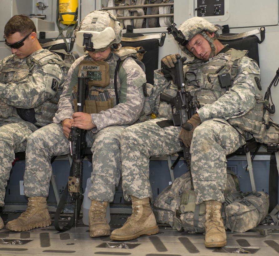 Army National Guard soldiers catch a few minutes of sleep aboard a C-17 Globemaster en route to Fort Hunter Liggett in central California, June 6, 2015. U.S. Air Force photo by Heide Couch