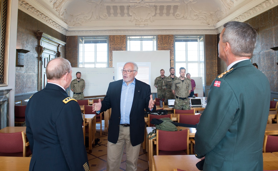 U.S. Army Gen. Martin E. Dempsey, left, chairman of the Joint Chiefs of Staff, and Danish Chief of Defense Army Gen. Peter Bartram briefly interrupt a class at the Royal Danish Army Academy in Copenhagen, Denmark, Aug. 17, 2015. DoD photo by D. Myles Cullen