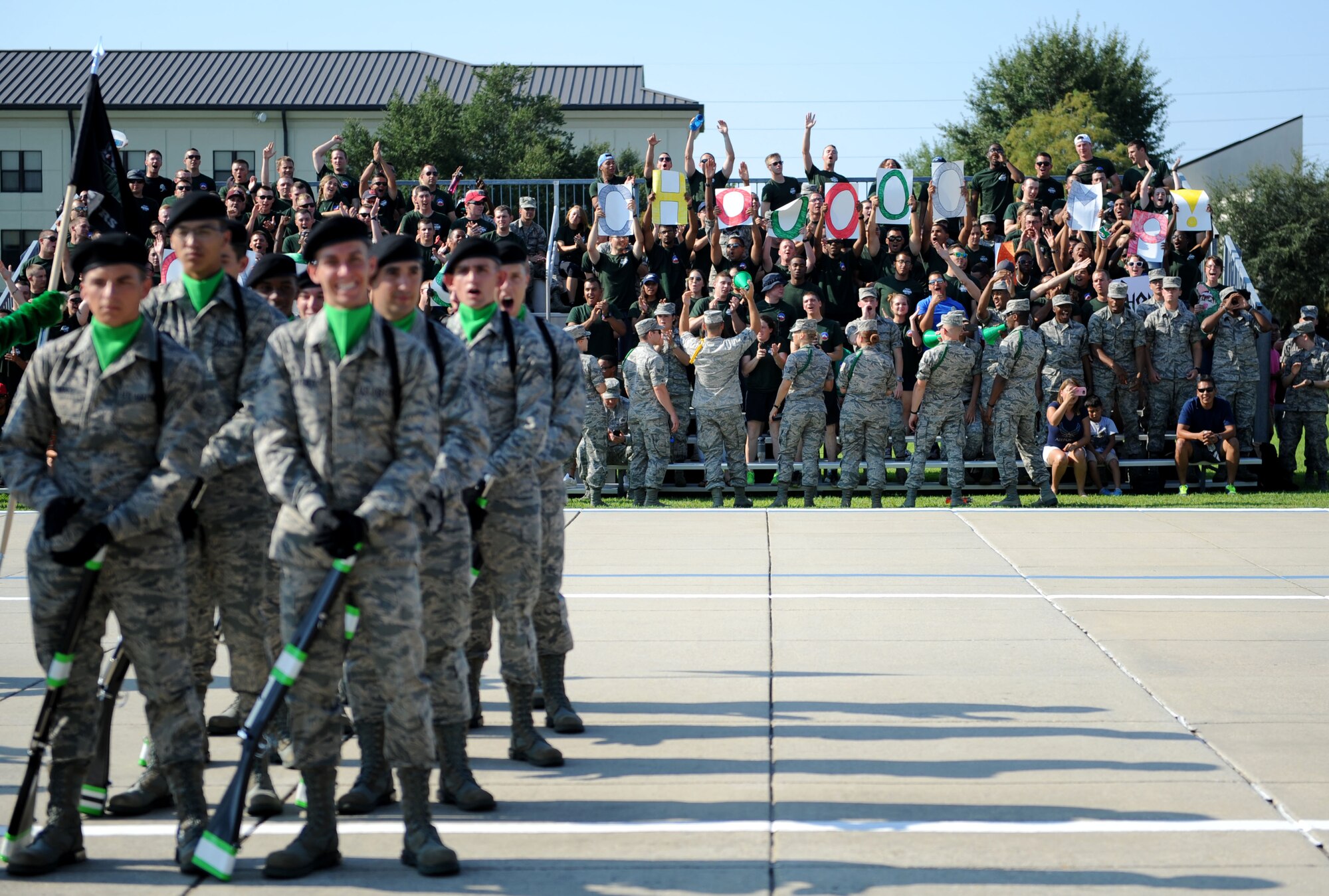 Members of the 334th Training Squadron, cheer after being announced as the overall winners during the 81st Training Group drill down Aug. 14, 2015, at the Levitow Training Support Facility Drill Pad, Keesler Air Force Base, Miss. The 334th TRS “Gators” also placed first in the open ranks and regulation competitions. (U.S. Air Force photo by Kemberly Groue)