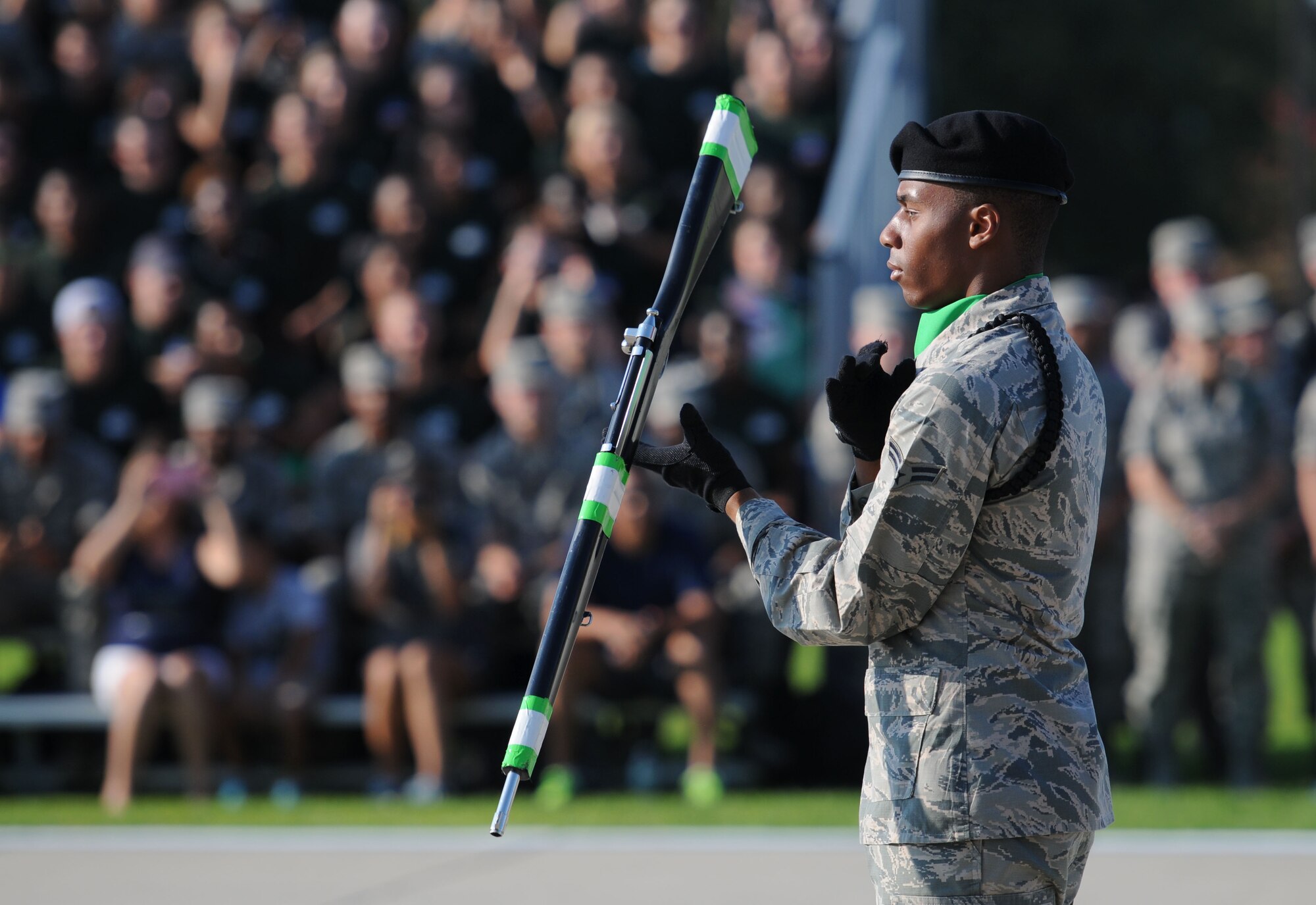 Airman 1st Class Wilson Gardner, 334th Training Squadron freestyle drill team member, spins his rifle during the freestyle portion of the 81st Training Group drill down Aug. 14, 2015, at the Levitow Training Support Facility Drill Pad, Keesler Air Force Base, Miss. The 334th TRS “Gators” placed second in the freestyle competition and first overall. (U.S. Air Force photo by Kemberly Groue)