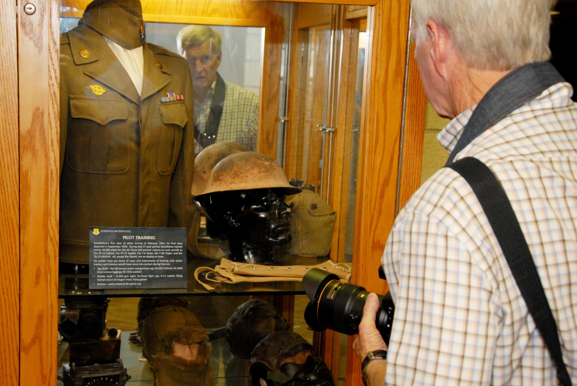 Retired U.S. Army 1st Lt. Joe Cornelison, Vietnam War veteran, looks at the pilot training display inside the Norma Brown Building on Goodfellow Air Force Base, Texas, Aug. 14, 2015. Cornelison and other Vietnam veterans visited the base as part of a collaborative 50-year commemoration event between Angelo State University and Goodfellow Air Force Base. (U.S. Air Force photo by Senior Airman Joshua Edwards/Released)