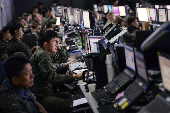 Members from U.S. and Republic of Korea militaries man the Hardened Theater Air Control Center, at Osan Air Base, ROK, during the first day of Ulchi Freedom Guardian, Aug. 17, 2015. UFG is held annually to strengthen the U.S.-ROK alliance commanders’ and staff members’ ability to translate information into actionable decision-making. Portions of the image were blurred for security concerns. (U.S. Air Force photo/Airman 1st Class John Linzmeier)