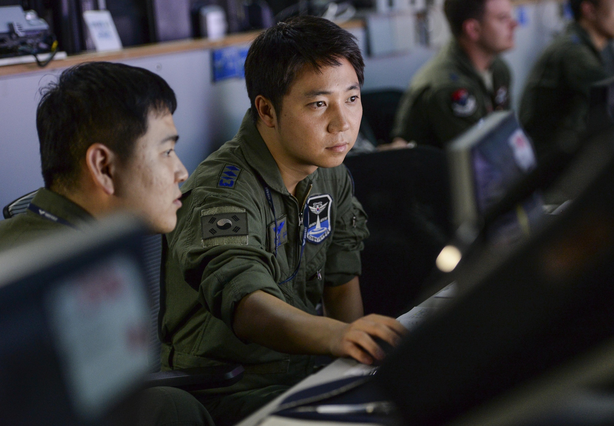 Republic of Korea Air Force Capt. Won Jung Seung, 6th Rescue Group pilot, monitors ROK air space at the Hardened Theater Air Control Center, Osan Air Base, ROK, during the first day of Ulchi Freedom Guardian, Aug. 17, 2015. Part of Won’s responsibility is to receive and relay vital information to commanders in order to support air rescue operations. UFG is an annual exercise that brings together U.S., ROK and other allied forces in an effort to ensure readiness to defend the ROK and help maintain stability on the Korean Peninsula. (U.S. Air Force photo by Airman 1st Class John Linzmeier/Released)