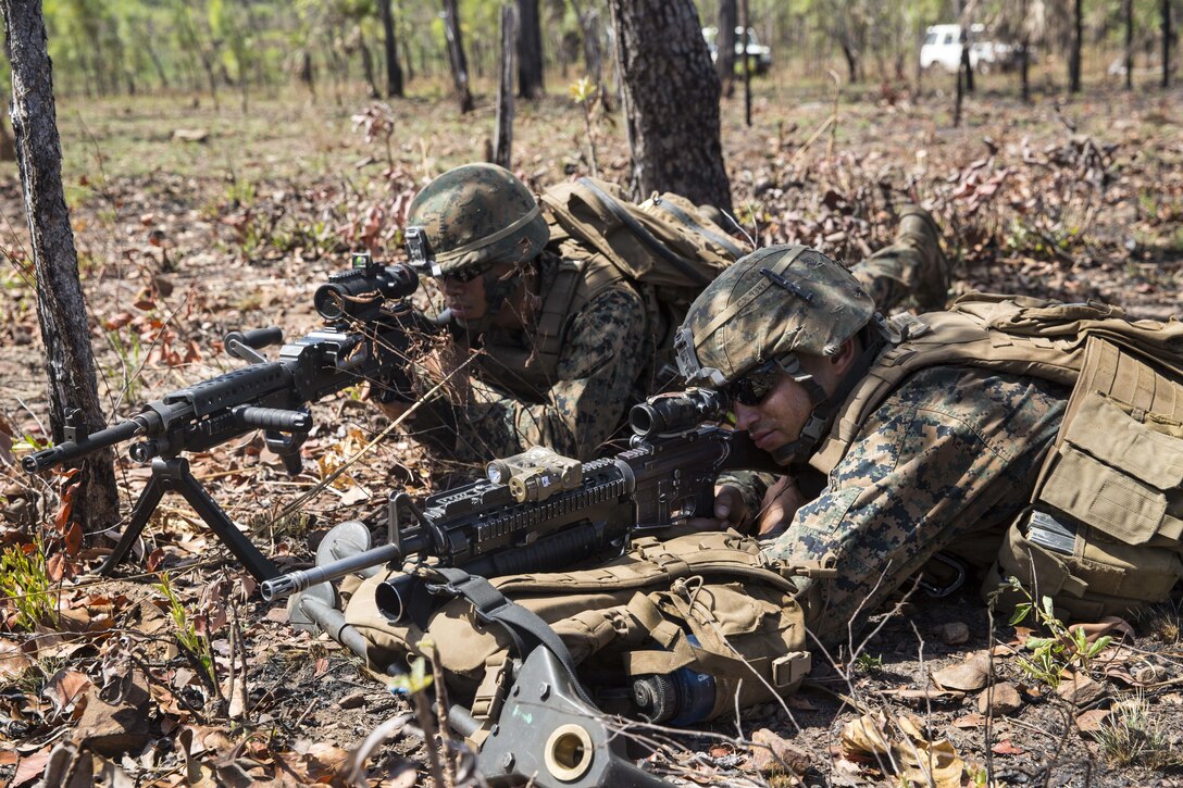 U.S. Marines with Company C, 1st Battalion, 4th Marine Regiment, Marine Rotational Force – Darwin, sight in on simulated enemy combatants during helicopter raid training Aug. 7 at the Kangaroo Flats Training Area, Northern Territory, Australia. Along with the Marines, Australian soldiers with Delta Company, 5th Battalion, The Royal Australian Regiment, Australian Army, Australian Defence Force, used the bilateral training to familiarize their units with conducting a platoon-level assault on a simulated enemy encampment and securing intelligence. The rotational deployment in Darwin enables Marines to more effectively train, exercise and operate with their partners, enhancing regional security and building a capacity to respond more rapidly to natural disasters and crises throughout that region. 