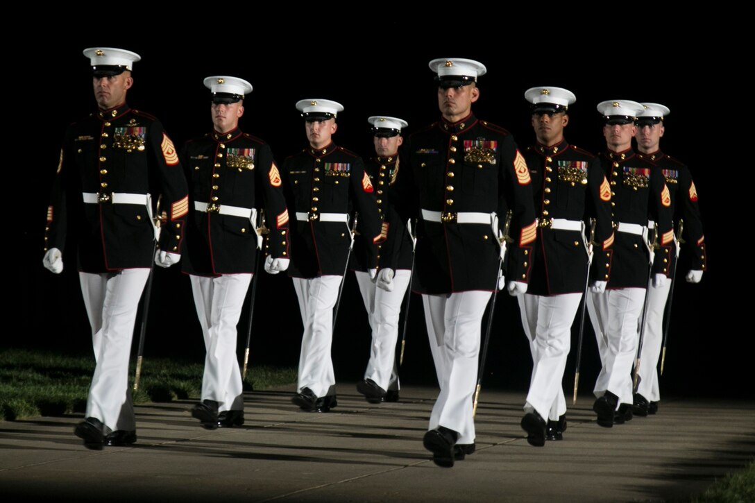The Staff Non-Commissioned Officers of Alpha and Bravo Companies perform during a Friday Evening Parade at Marine Barracks Washington, D.C., Aug. 14, 2015. The guest of honor for the Evening Parade was Lance Cpl. Joshua Leakey recipient of the Victoria Cross, the highest military decoration for valor in the British and Commonwealth armed forces, and the hosting official was Lt. Gen. Jon Davis, deputy commandant for Aviation.
