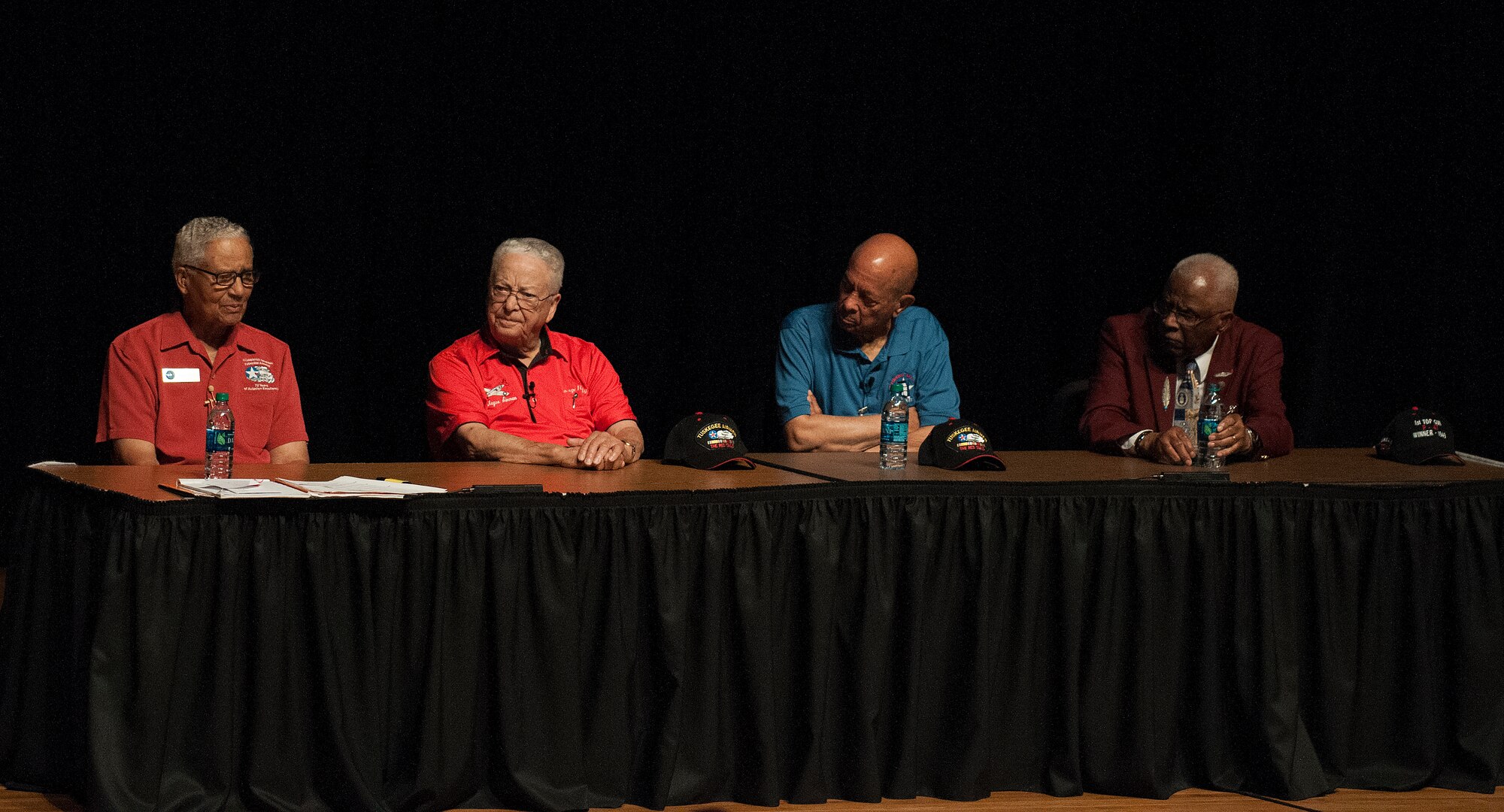 From left to right, retired Col. Charles McGee and Lt. Cols. George Hardy, Harry Stewart and James Harvey III, four of the original Tuskegee Airmen, respond to a question about their military career during a presentation at the Cheyenne Civic Center, Cheyenne, Wyo., August 14, 2015. Out of the 354 Tuskegee pilots who flew in combat missions during World War II, only 21 remain. (U.S. Air Force photo by Airman 1st Class Brandon Valle)