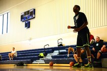 Airman Derrick Norman, 341st Force Support Squadron, plays offense during a basketball game amongst peers at the Malmstrom Fitness and Sports Center Aug. 12, 2015, at Malmstrom Air Force Base, Mont. Norman brings a positive dynamic to the 341st FSS team by being the assistant special events coordinator and an avid lover of basketball.  (U.S. Air Force photo/Airman 1st Class Magen M. Reeves)
