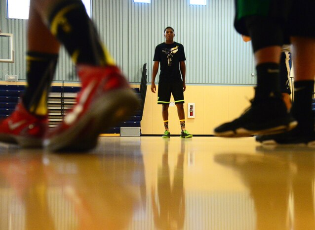 Airman Derrick Norman, 341st Force Support Squadron, plays a game of basketball amongst peers Aug. 12, 2015, at Malmstrom Air Force Base, Mont. Norman works at the Malmstrom Fitness and Sports Center where his love and knowledge of sports are helping him succeed in the 341st FSS. (U.S. Air Force photo/Airman 1st Class Magen M. Reeves)