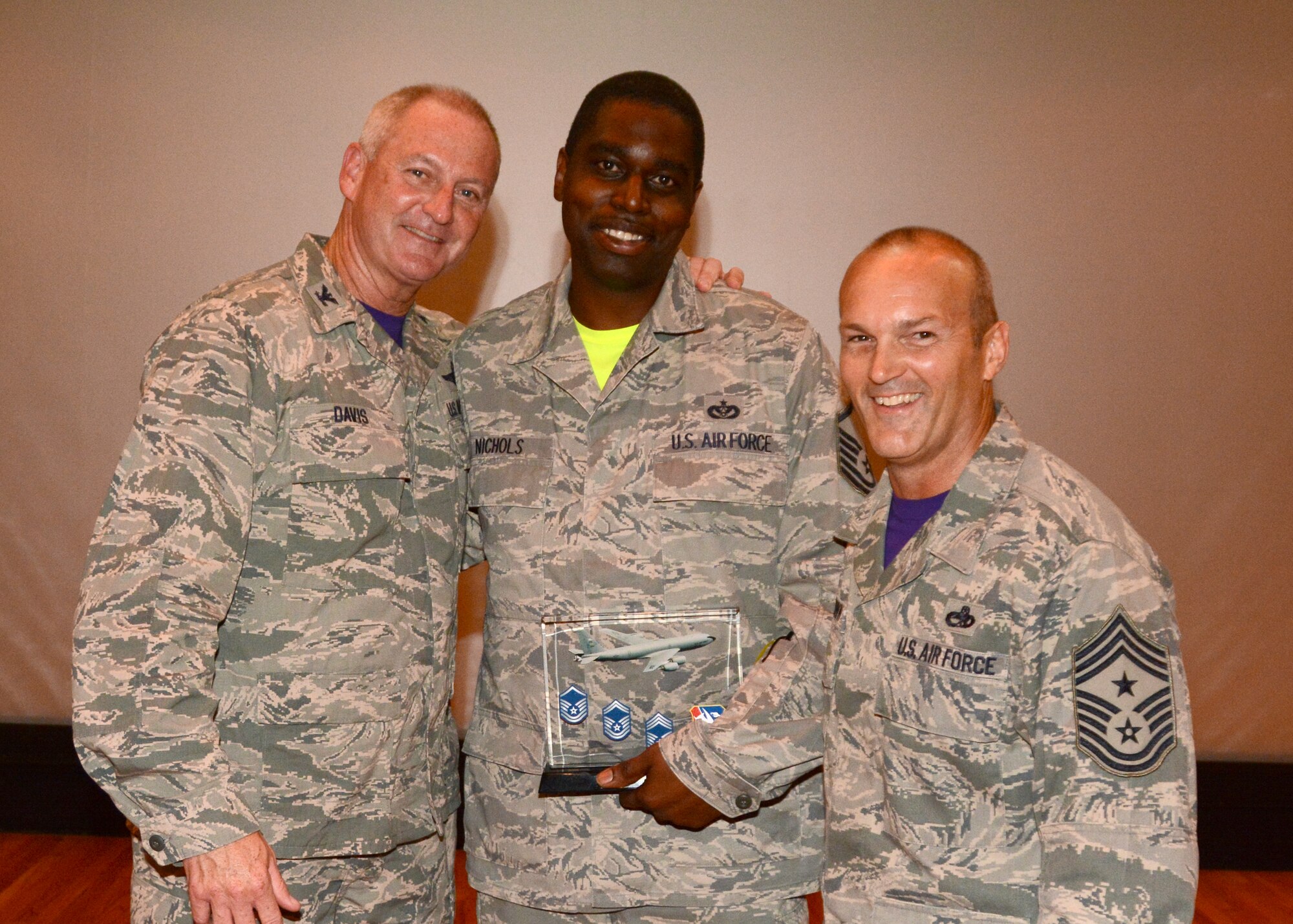 Master Sgt. Demetrius L. Nichols, 507th Civil Engineer Squadron, accepts his award for Senior Noncommissioned Officer of the Quarter for the second quarter 2015 in the base theater at Tinker Air Force Base, Okla., August 9, 2015. (U.S. Air Force Photo/ Staff Sgt. Lauren Gleason)

