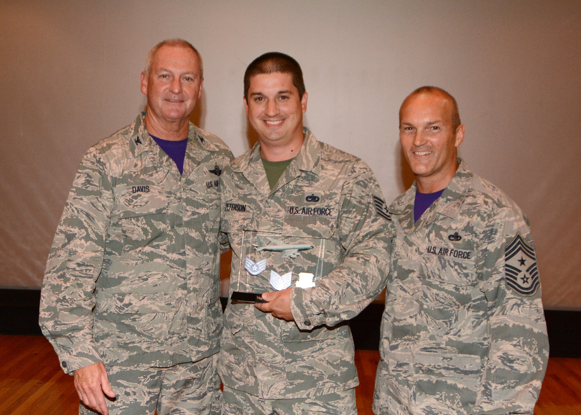 Tech. Sgt. Benjamin M. Peterson, 507th Aircraft Maintenance Squadron, accepts his award for Noncommissioned Officer of the Quarter for the second quarter 2015 in the base theater at Tinker Air Force Base, Okla., August 9, 2015. (U.S. Air Force Photo/ Staff Sgt. Lauren Gleason)

