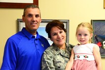 Col. Denise L. Cooper, 341st Mission Support Group commander, poses for a photo with her husband Scott and daughter Jenna Aug. 14, 2015, at Malmstrom Air Force Base, Mont. Cooper is the new MSG commander here and is excited to be in leadership focusing on Airmen and readiness. (U.S. Air Force photo/Airman 1st Class Magen M. Reeves)