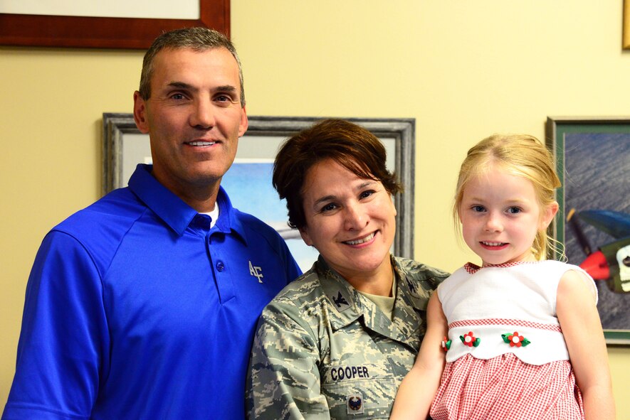 Col. Denise L. Cooper, 341st Mission Support Group commander, poses for a photo with her husband Scott and daughter Jenna Aug. 14, 2015, at Malmstrom Air Force Base, Mont. Cooper is the new MSG commander here and is excited to be in leadership focusing on Airmen and readiness. (U.S. Air Force photo/Airman 1st Class Magen M. Reeves)