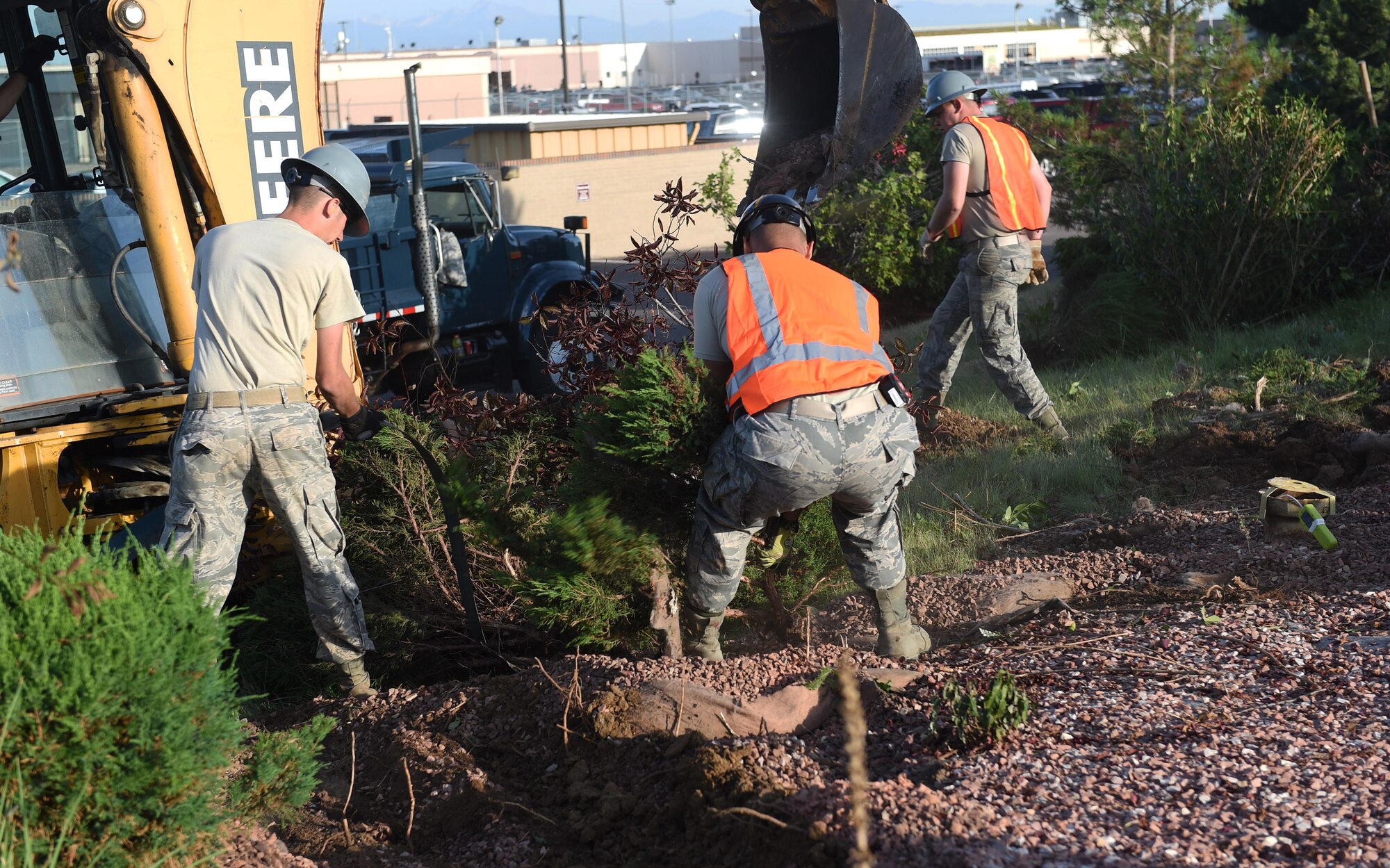 The 460th Civil Engineer Squadron works on repairing a gas leak outside of Panther Den Aug. 7, 2015, on Buckley Air Force Base, Colo. The gas leak caused a temporary re-route of traffic on Aspen Rd. between Devils Thumb Avenue and Keystone Avenue and closed Panther Den for part of the day. (U.S. Air Force photo by Airman 1st Class Samantha Meadors/Released)