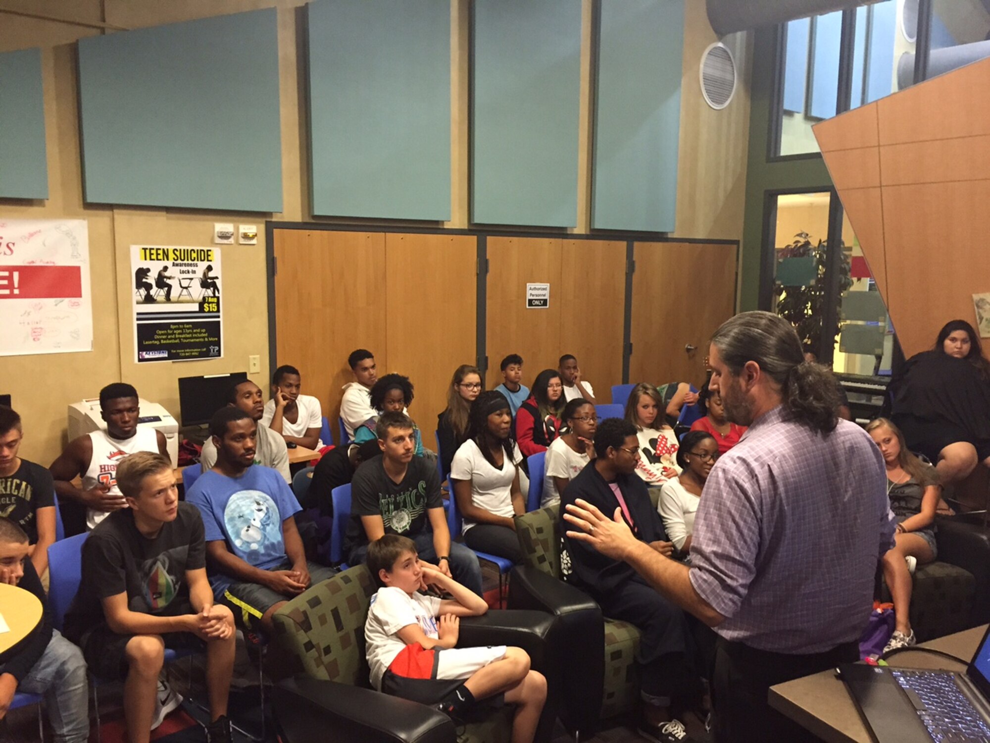 Teens learn about the warning signs of suicide and sources of support during the Suicide Prevention and Awareness lock-in at the Buckley Youth Center Aug. 7, 2015, on Buckley Air Force Base, Colo. Aside from education, the lock-in also featured other activities such as laser tag and basketball tournaments. (photo courtesy of the Buckley Youth Center)