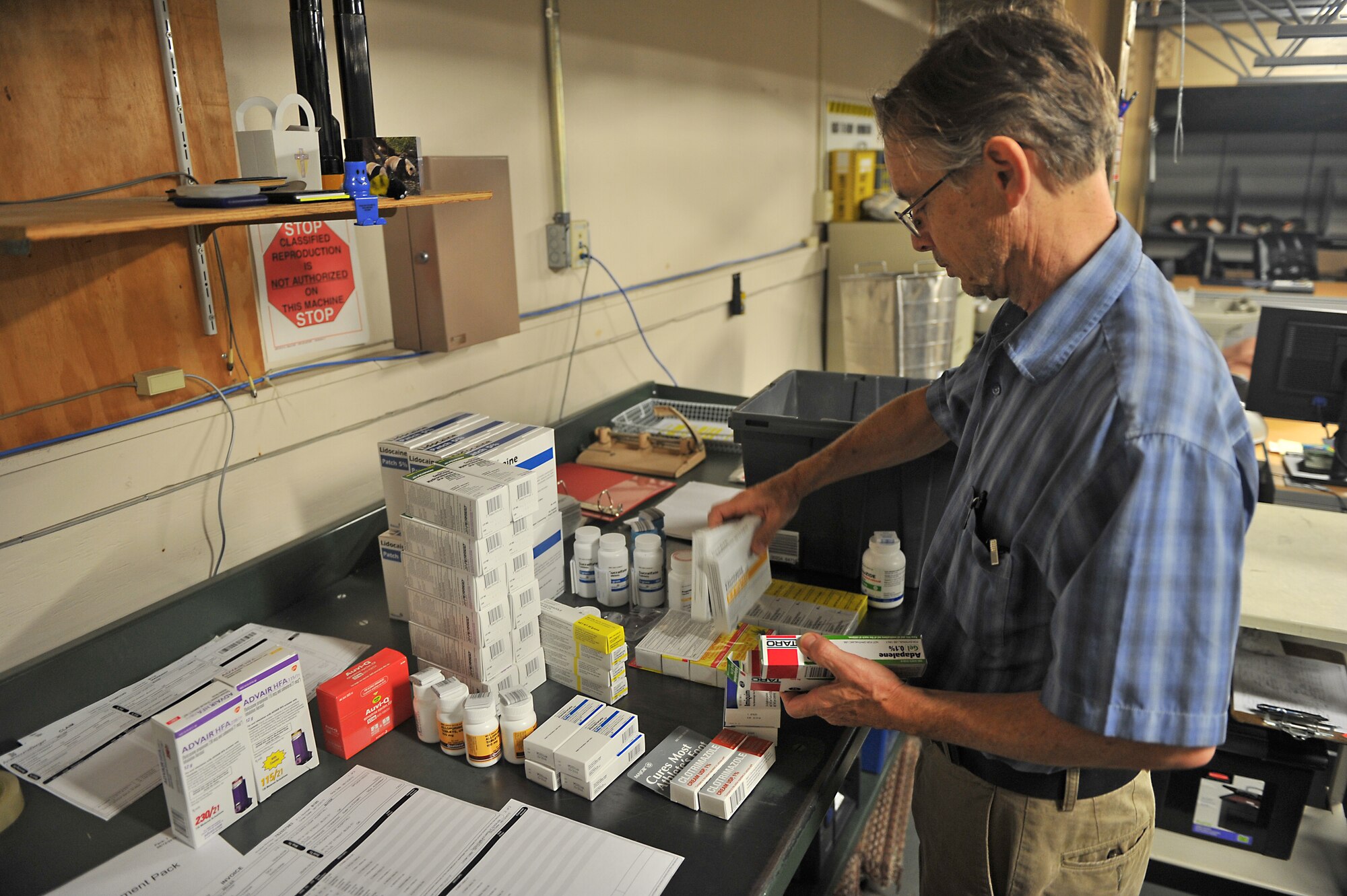 ALTUS AIR FORCE BASE, Okla. – Steve Redeker, 97th Medical Group warehouse material manager, accounts for medical supplies inside the medical group warehouse, Aug. 13, 2015. Redeker ensures the items are not about to expire and that they received their entire order. (U.S. Air Force photo by Senior Airman Dillon Davis/Released)