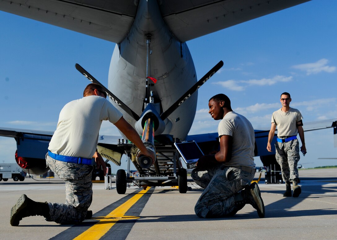 Airmen from the 22nd Aircraft Maintenance Squadron hydraulics shop inspect the boom on a KC-135 Stratotanker, Aug. 13, 2015, at McConnell Air Force Base, Kan. The Airmen conducted an hourly post-flight inspection of the aircraft to avoid issues that could prevent it from flying safely. (U.S. Air Force photo by Senior Airman Victor J. Caputo)