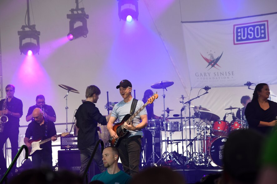 Gary Sinise, actor and Lt. Dan Band co-founder, plays a concert outside of Malmstrom Air Force Base’s Fitness and Sports Center Aug 16. Since its inception in 2003, the band has played hundreds of shows for military members all across the globe. (U.S. Air Force photo/Airman 1st Class Collin Schmidt)