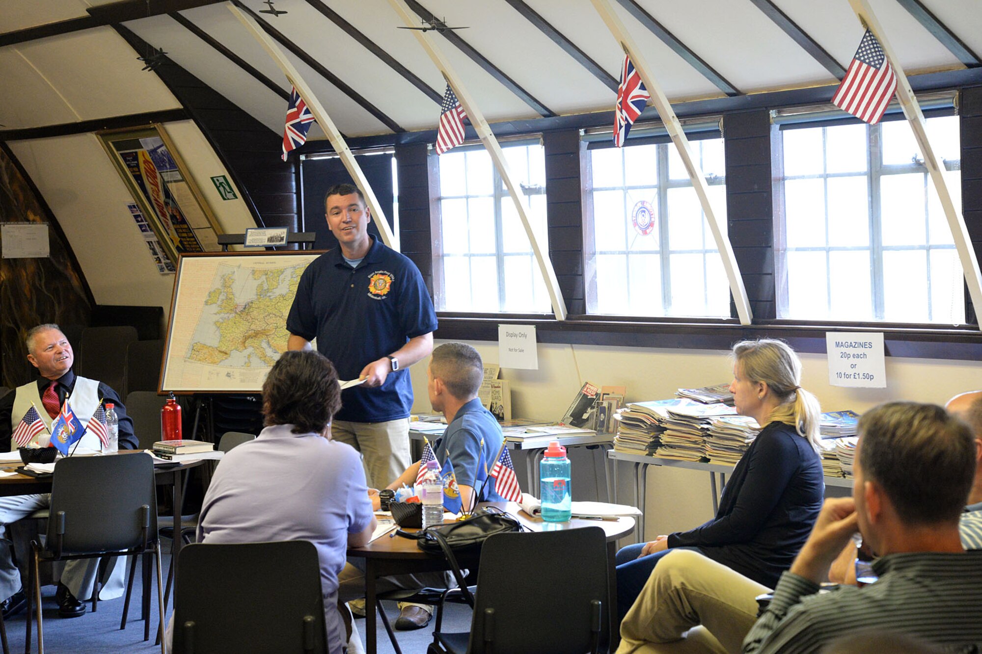 U.S. Air Force Senior Master Sgt. Ronald Garbarini, 95th Reconnaissance Squadron quality assurance superintendent, shares historical stories with commanders and chief master sergeants of the 100th Air Refueling Wing Aug. 14, 2015, during a senior leader staff visit to Thorpe Abbots in Norfolk, England. Gabarini, along with the wing historian and other members of the 100th ARW heritage society, shared historical background and anecdotes of the 100th ARW dating back to its roots as the 100th Bombardment Group during World War II. Wing leadership gathered in hopes of learning more about their unit’s history.  (U.S. Air Force photos by Senior Airman Kate Thornton/Released)