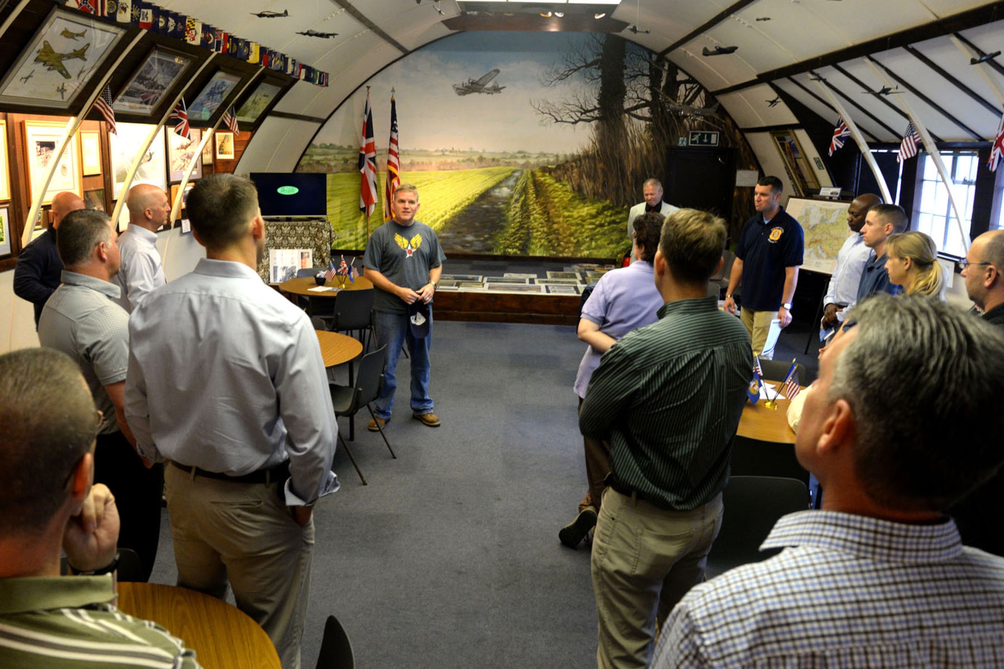 U.S. Air Force Col. Thomas Torkelson, center, 100th Air Refueling Wing commander, welcomes group and squadron commanders and chief master sergeants of the 100th ARW Aug. 14, 2015, during a senior leader staff visit to Thorpe Abbots in Norfolk, England. The 100th ARW descends from the 100th Bombardment Group originally located at Thorpe Abbots during World War II. Wing leadership gathered in hopes of learning more about their unit’s history and to gain a better understanding their heritage.  (U.S. Air Force photos by Senior Airman Kate Thornton/Released) 