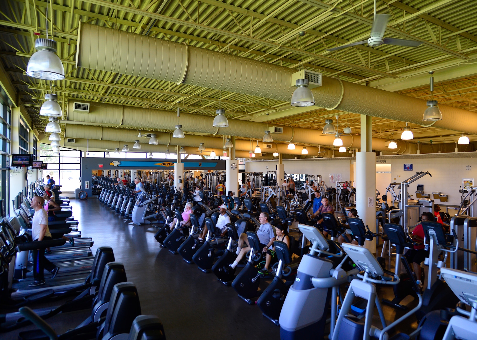 Team Dover Airmen and civilian visitors workout at the Fitness Center Aug. 13, 2015, on Dover Air Force Base, Del. The Fitness Center and fitness programs offered by the facility are now able to be utilized unlimitedly by civilian visitors who are signed in by military personnel. (U.S. Air Force photo/Airman 1st Class William Johnson) 