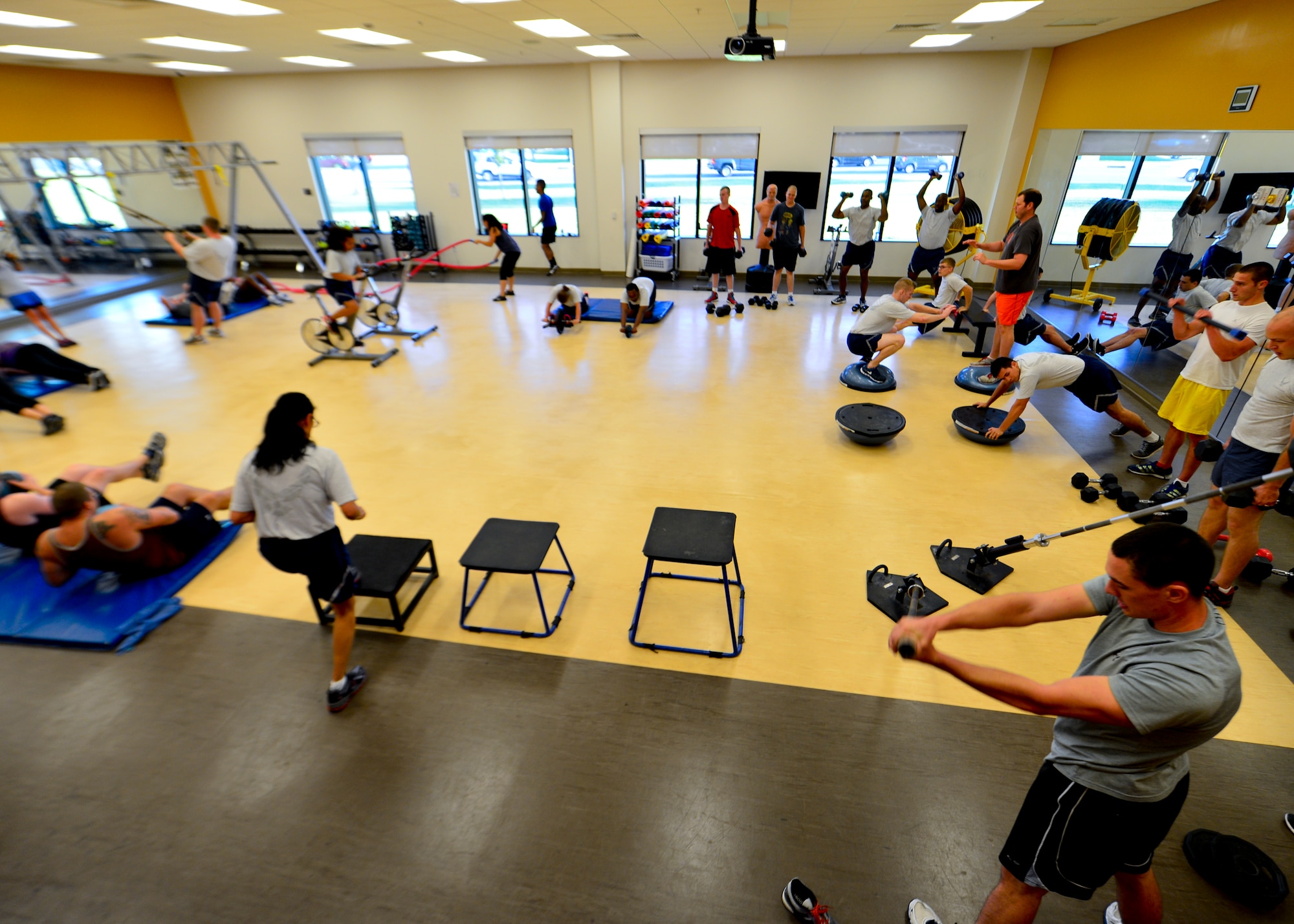 Team Dover Airmen and civilian visitors participate in the “48 Minutes of Hell” fitness program Aug. 13, 2015, at the Fitness Center on Dover Air Force Base, Del. Civilian visitors signed in by military personnel are eligible to participate in the more than 30 fitness programs offered by the Fitness Center. (U.S. Air Force photo/Airman 1st Class William Johnson)