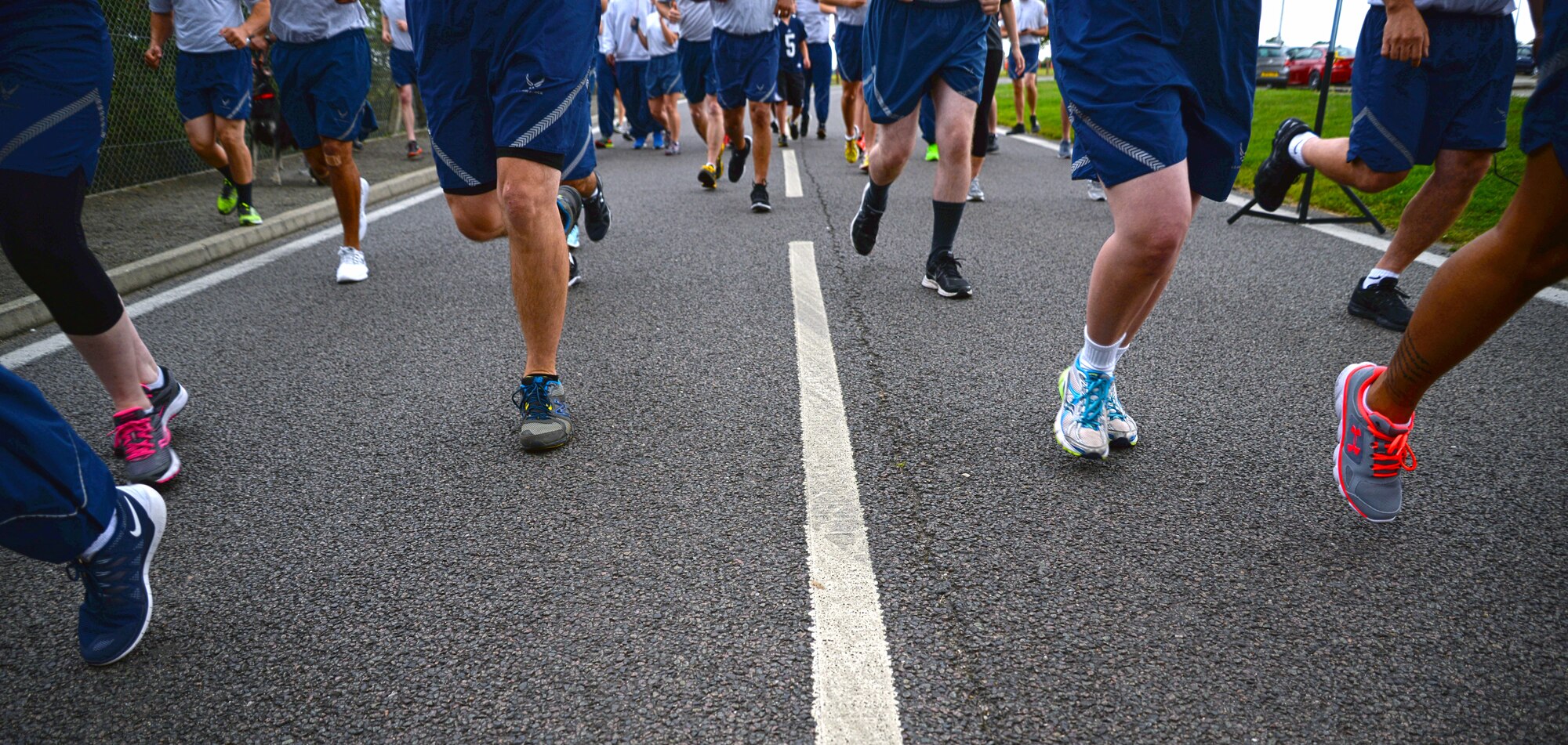 Team Mildenhall Airmen begin the monthly 5k run Aug. 14, 2015, on RAF Mildenhall, England. The run is mandatory for all 100th Air Refueling Wing military personnel, however tenant units and base ID card holders of 13 years and older are welcome to attend. (U.S. Air Force photo by Senior Airman Christine Halan/Released) 