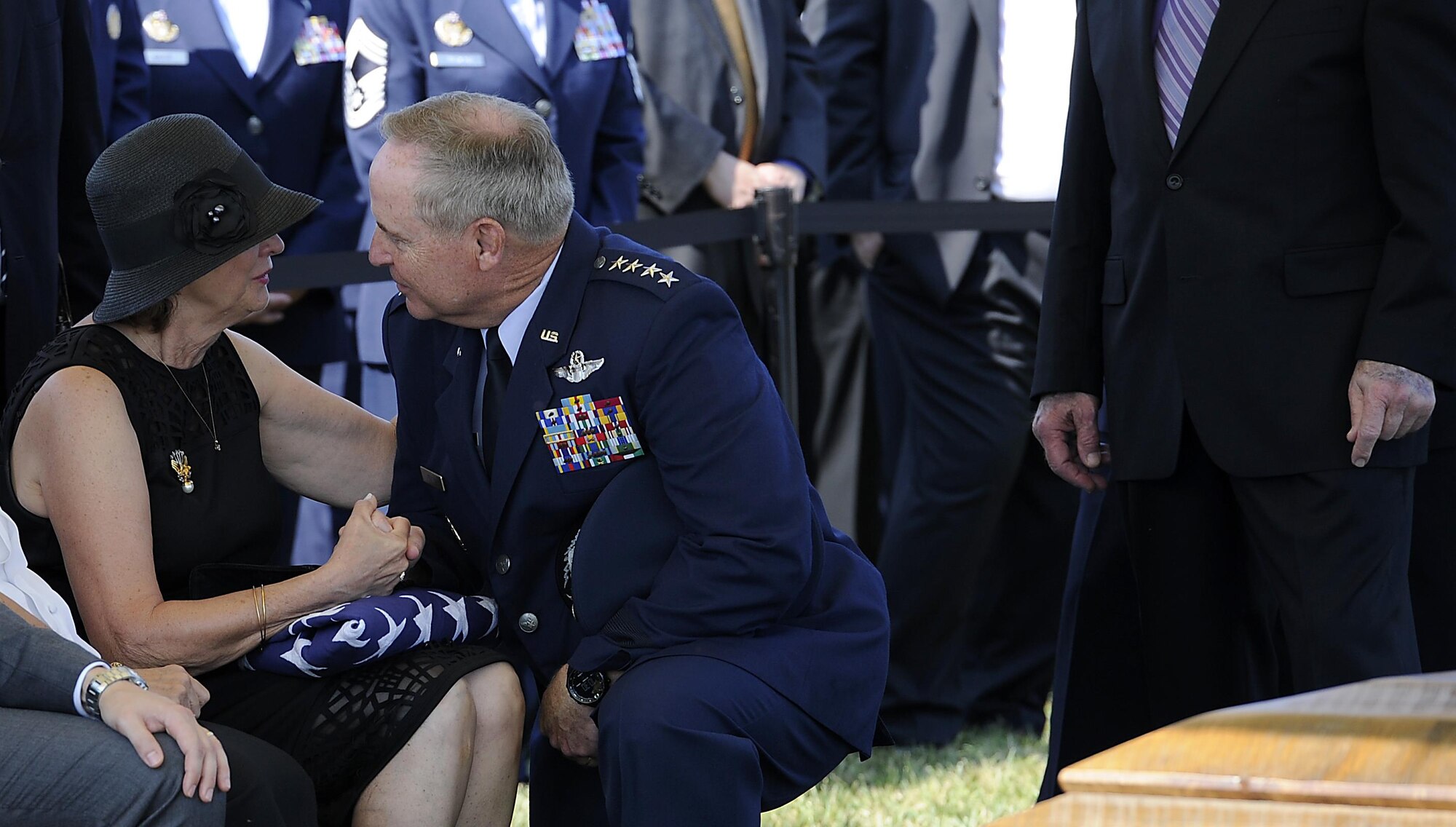 Air Force Chief of Staff Gen. Mark A. Welsh III comforts Jan Binnicker, widow of ninth Chief Master Sgt. of the Air Force James C. Binnicker is laid to rest in Arlington National Cemetery, Va., Aug. 14, 2015. Binnicker passed away March 21 in Calhoun, Ga. (U.S. Air Force photo/Senior Airman Preston Webb)
