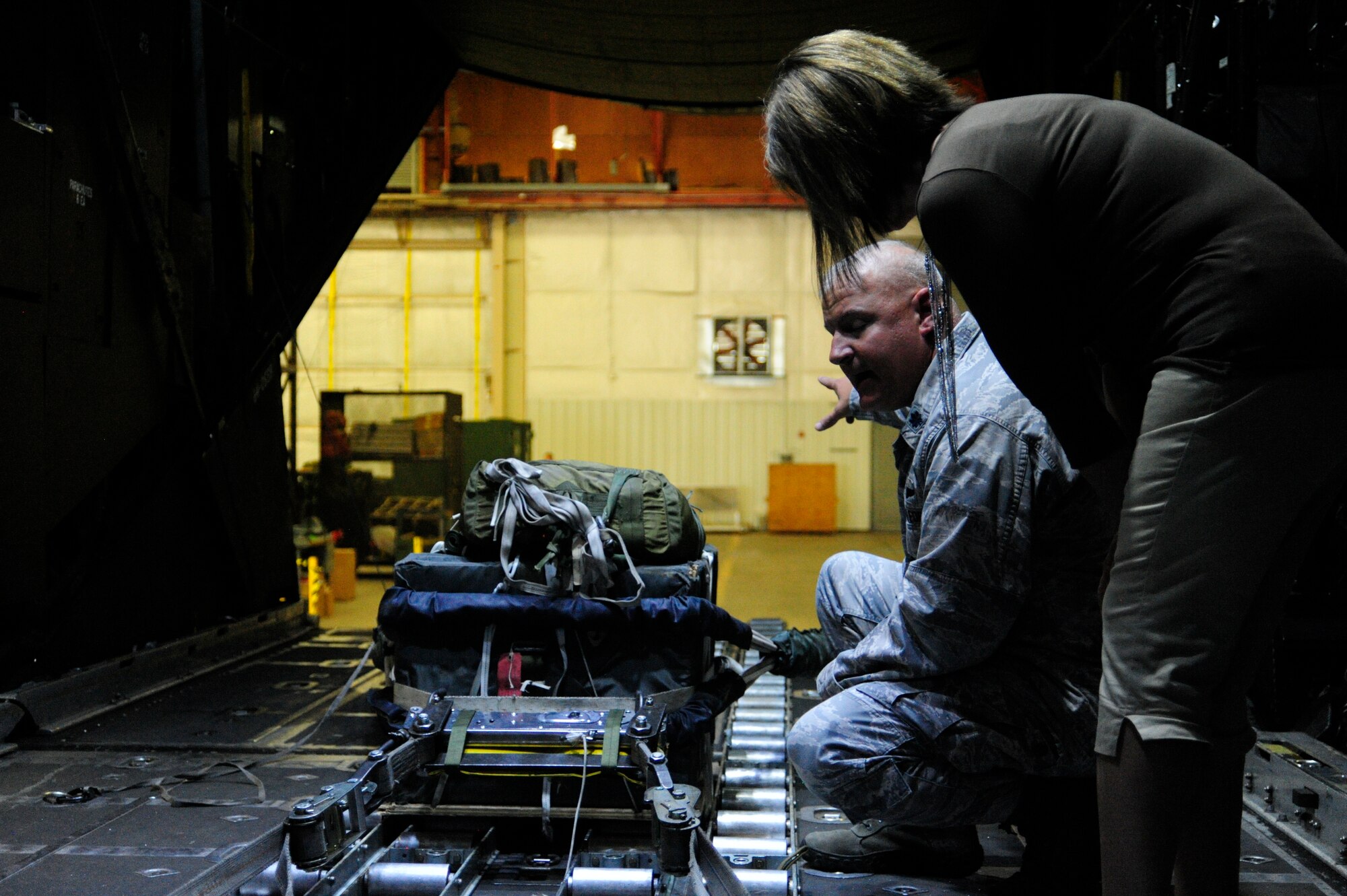 Carlene Joseph, McChord Field civic leader, receives instructions on releasing a training bundle during a tour of the 58th Special Operations Wing "Monster Garage," Aug. 13, 2015 as part of the 2015 McChord Field Fly-away Civic Leader tour of Kirtland Air Force Base, New Mexico. The 58th SOW serves as the premier training site for Air Force special operations and combat search and rescue aircrews.  (U.S. Air Force photo/Staff Sgt. Katie Jackson)