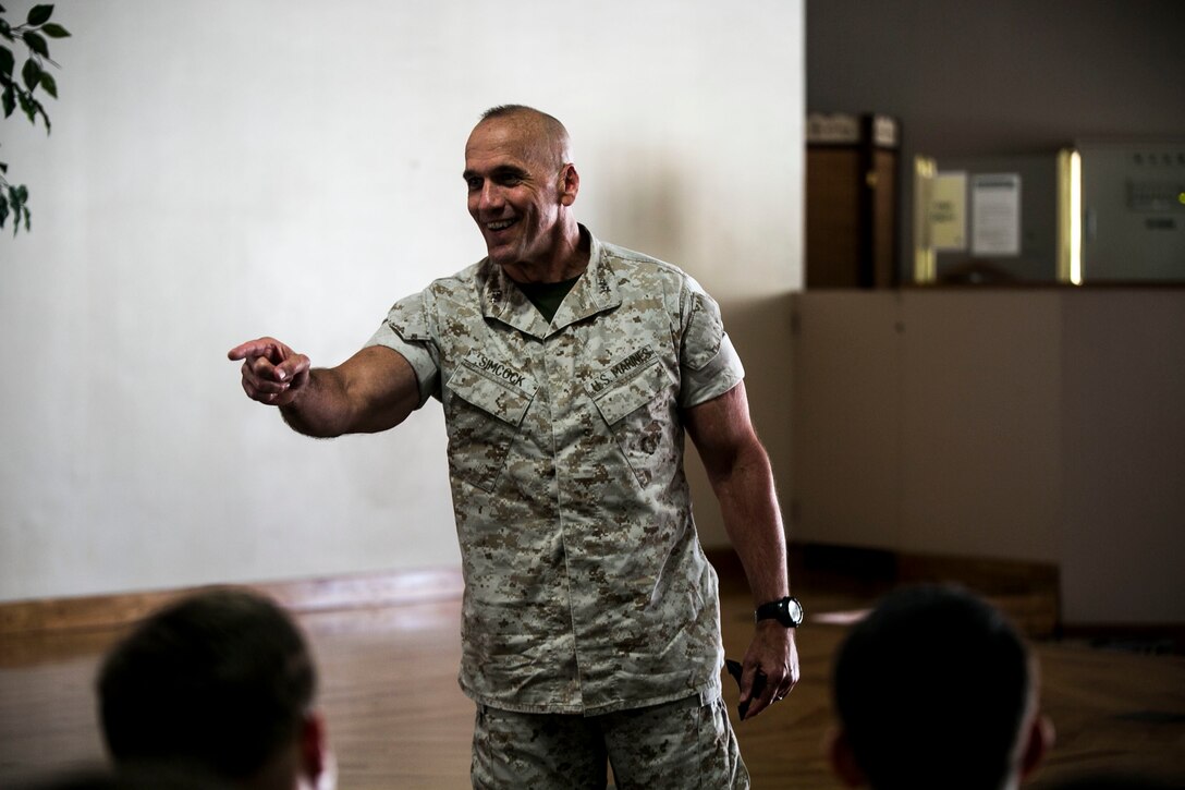 Maj. Gen. Richard L. Simcock II interacts with Sailors of 3rd Marine Division during his speech over key issues in the Pacific region at Camp Hansen, Okinawa, Japan, Aug. 7, 2015. Simcock, from San Mateo, California, expressed the importance of the Sailors' role in maintaining Pacific stability by building stronger partnerships with allied nations in the region. Strong alliances among partnered nations increase reliability in peacekeeping and humanitarian operations, he explained. Simcock is the commanding general of 3rd Marine Division, III Marine Expeditionary Force. 