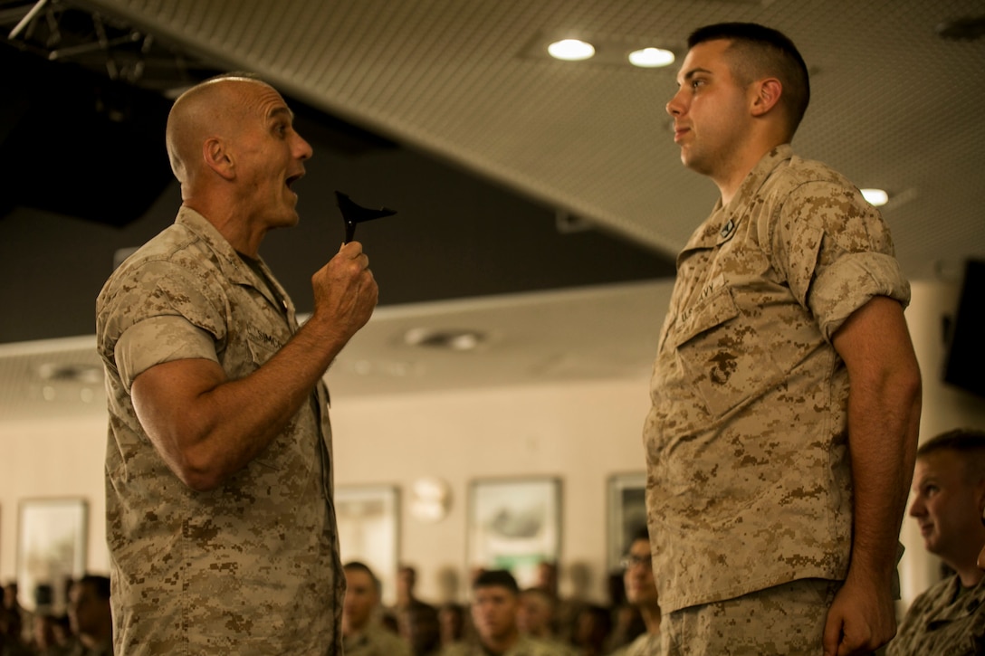 Maj. Gen. Richard L. Simcock II interacts with a Sailor of 3rd Marine Division during his speech over key issues in the Pacific region at Camp Hansen, Okinawa, Japan, Aug. 7, 2015. Simcock, from San Mateo, California, expressed the importance of Sailors' role in maintaining Pacific stability by building stronger partnerships with allied nations in the region. Strong alliances among partnered nations increase reliability in peacekeeping and humanitarian operations, he explained. Simcock is the commanding general of 3rd Marine Division, III Marine Expeditionary Force. 