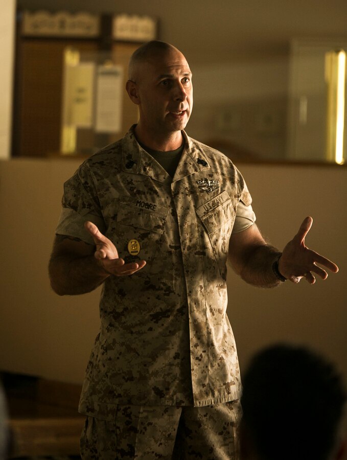 Master Chief Petty Officer Christopher W. Moore speaks to Sailors of the 3rd Marine Division at Camp Hansen, Okinawa, Japan, Aug. 7, 2015. Moore, from Glendale, Arizona, discusses with Sailors new policy changes he wishes to enforce and their thoughts over the policies. Moore is the command master chief of 3rd Marine Division, III Marine Expeditionary Force. 