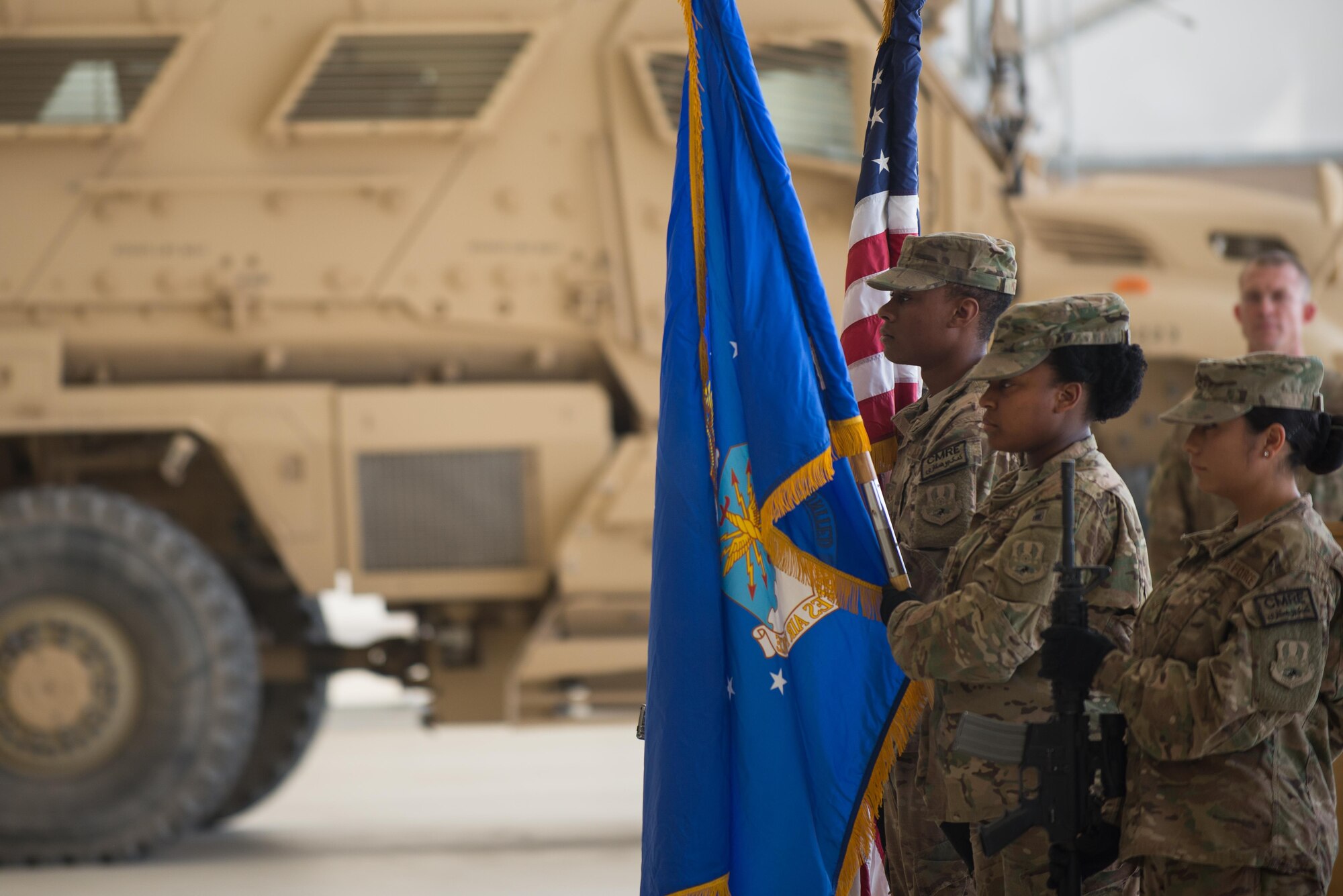 U.S. Airmen with the Kandahar Airfield Honor Guard present the colors during the 451st Air Expeditionary Group change of command ceremony at Kandahar Airfield, Afghanistan, Aug. 16, 2015. During the ceremony Col. Rhude Cherry III relinquished command of the 451st AEG to Col. James Curry.  (U.S. Air Force photo by Tech. Sgt. Joseph Swafford/Released)