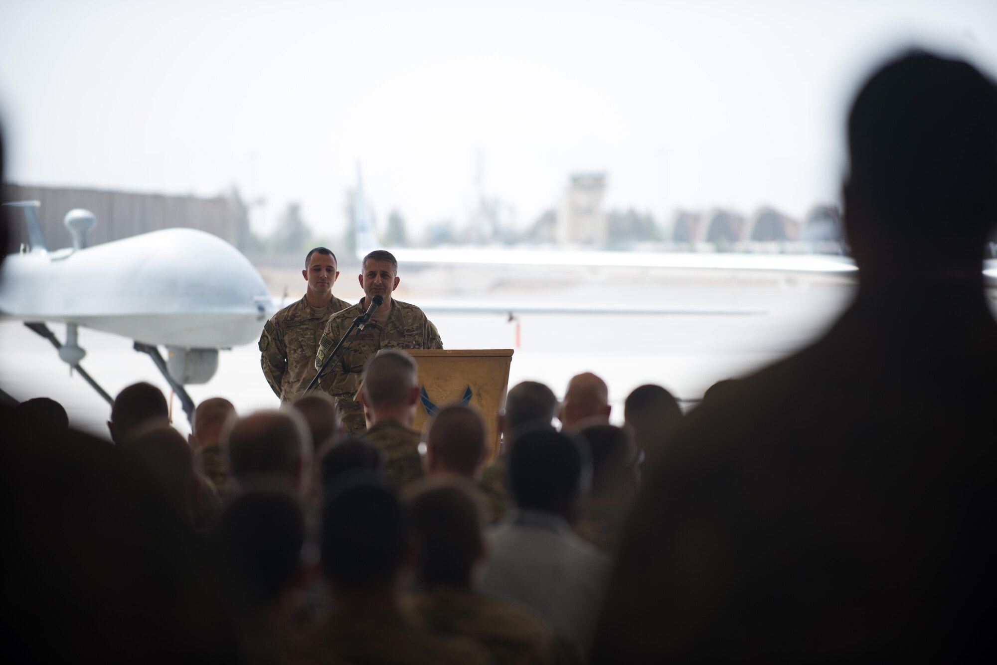 U.S. Air Force Brig. Gen. Dave Julazadeh, 455th Air Expeditionary Wing commander, speaks during the 451st Air Expeditionary Group change of command ceremony at Kandahar Airfield, Afghanistan, Aug. 16, 2015. During the ceremony Col. Rhude Cherry III relinquished command of the 451st AEG to Col. James Curry.  (U.S. Air Force photo by Tech. Sgt. Joseph Swafford/Released)