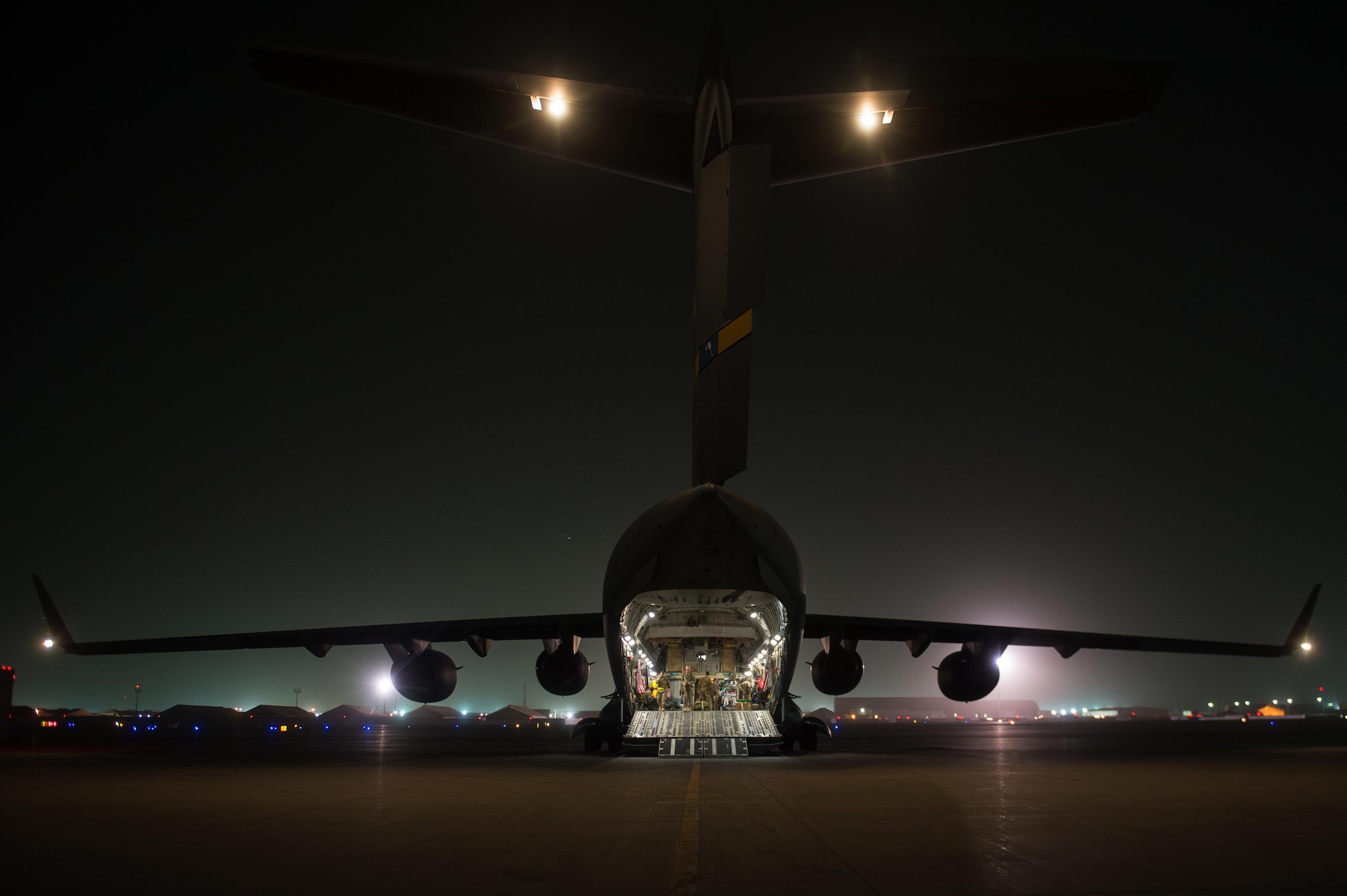 U.S. Airmen assigned to the 455th Expeditionary Aeromedical Evacuation Squadron and the 455th Expeditionary Medical Group load injured Service members onto a C-17 Globemaster III aircraft on the flight line at Bagram Airfield, Afghanistan, Aug. 8, 2015.  The 455th EAES Airmen are charged with the responsibility of evacuating the sick and wounded from Central Command to higher echelons of medical care. (U.S. Air Force photo by Tech. Sgt. Joseph Swafford/Released) 