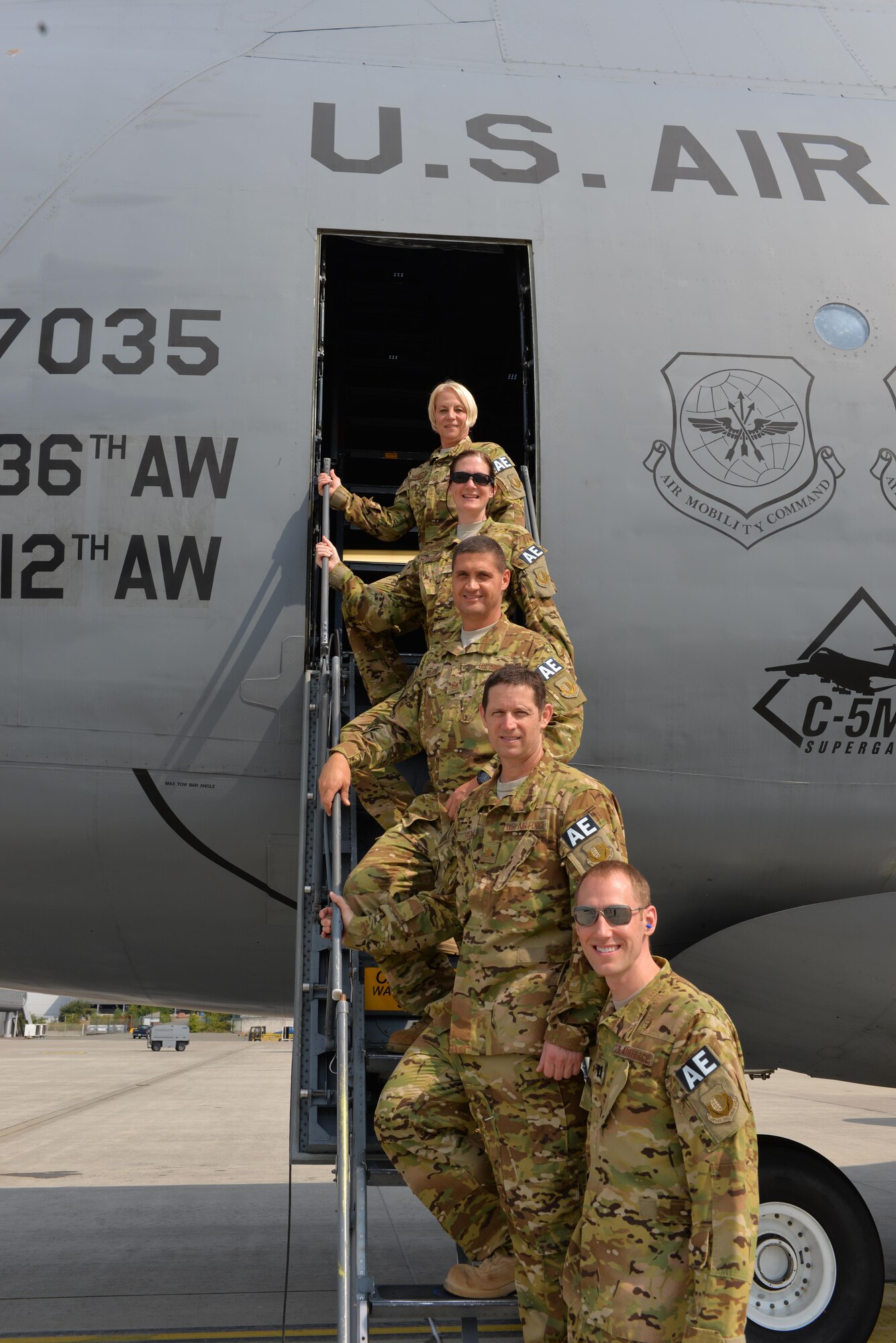 U.S. Airmen assigned to the 455th Expeditionary Aeromedical Evacuation Squadron pose for a photo after an AE mission to Germany prior to boarding a C-5M Galaxy, Aug. 12, 2015. The 455th EAES Airmen are charged with the responsibility of evacuating the sick and wounded from Central Command to higher echelons of medical care. (U.S. Air Force photo by Maj. Tony Wickman/Released)