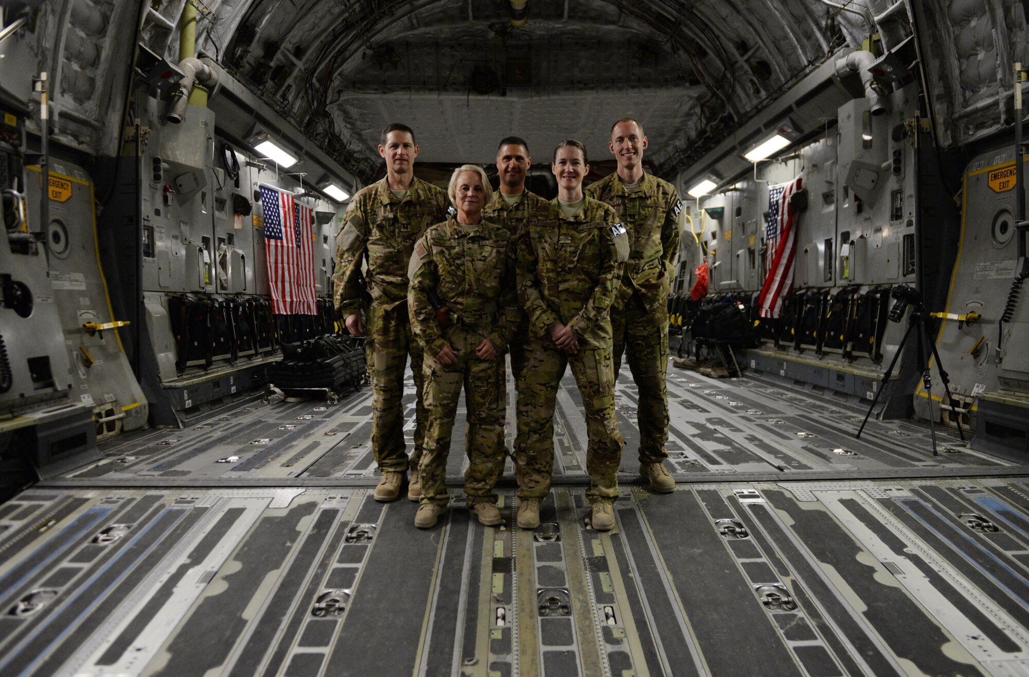 U.S. Airmen assigned to the 455th Expeditionary Aeromedical Evacuation Squadron pose for a photo aboard a C-17 Globemaster III aircraft before receiving patients for an AE mission to Germany at Bagram Airfield, Afghanistan, Aug. 9, 2015.  The 455th EAES Airmen are charged with the responsibility of evacuating the sick and wounded from Central Command to higher echelons of medical care. (U.S. Air Force photo by Maj. Tony Wickman/Released)