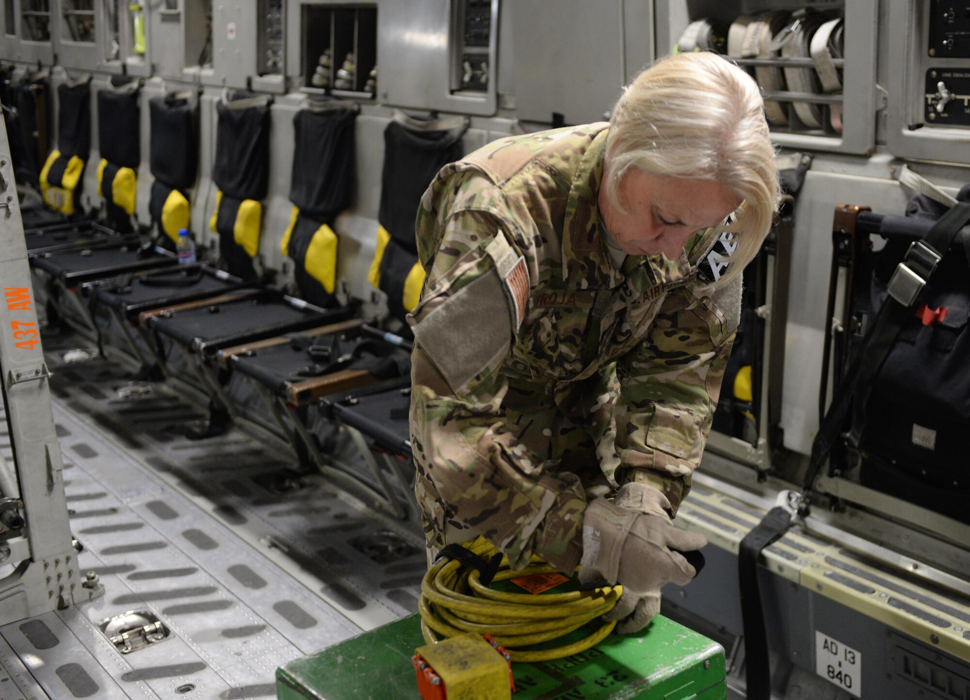 U.S. Air Force Master Sgt. Mary Troja, 455th EAES AE technician deployed from the Air Force Reserve’s 315th Air Expeditionary Squadron at Joint Base Charleston, South Carolina, and breaks down equipment on a C-17 Globemaster III aircraft that transported injured Service members from Bagram Airfield, Afghanistan, to Ramstein Air Base, Germany, Aug. 9, 2015.  The 455th EAES Airmen are charged with the responsibility of evacuating the sick and wounded from Central Command to higher echelons of medical care. (U.S. Air Force photo by Maj. Tony Wickman/Released)
